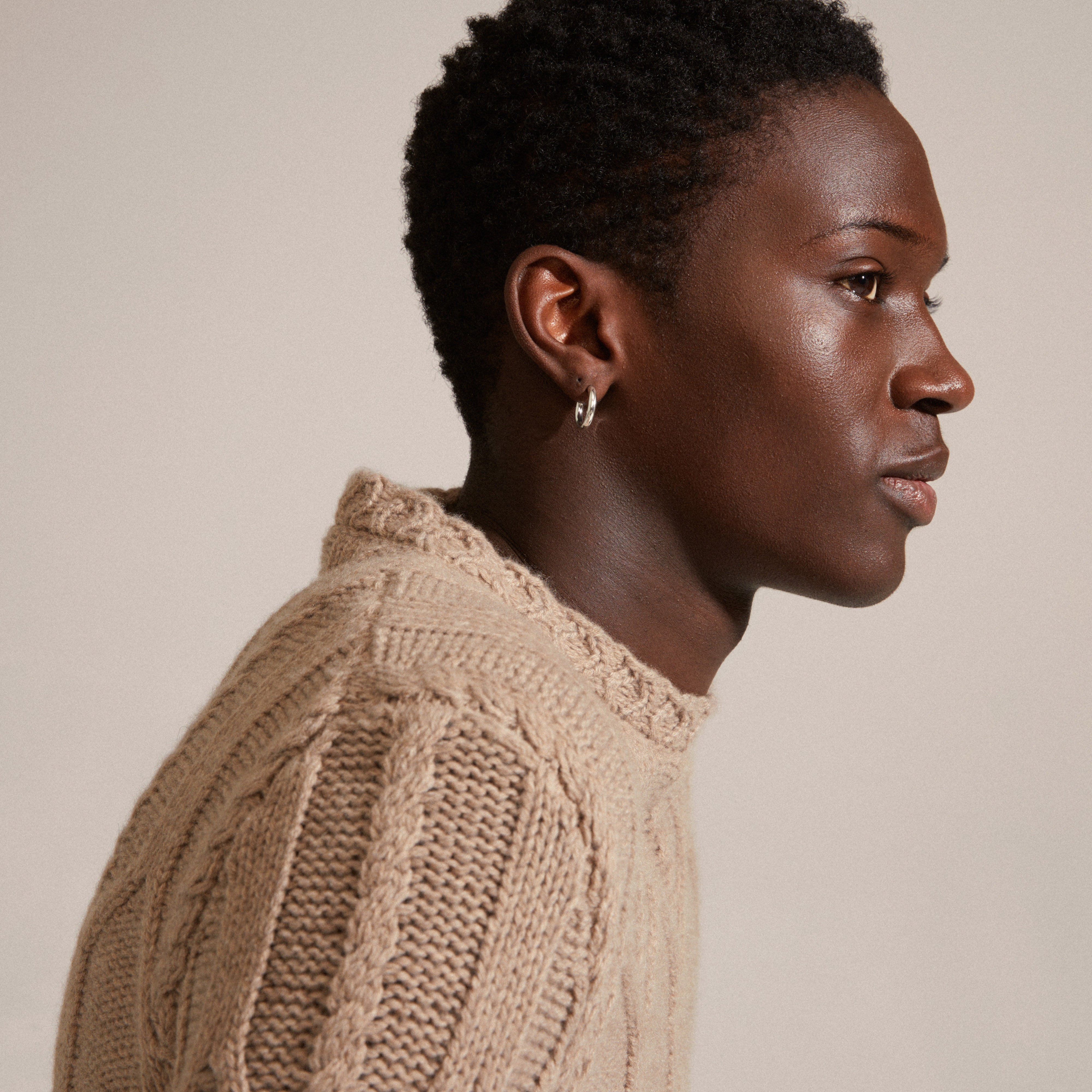 Close-up of DOLAG silver-plated chunky hoop earrings, showcasing their shiny finish, ideal for mixing and matching with other styles.