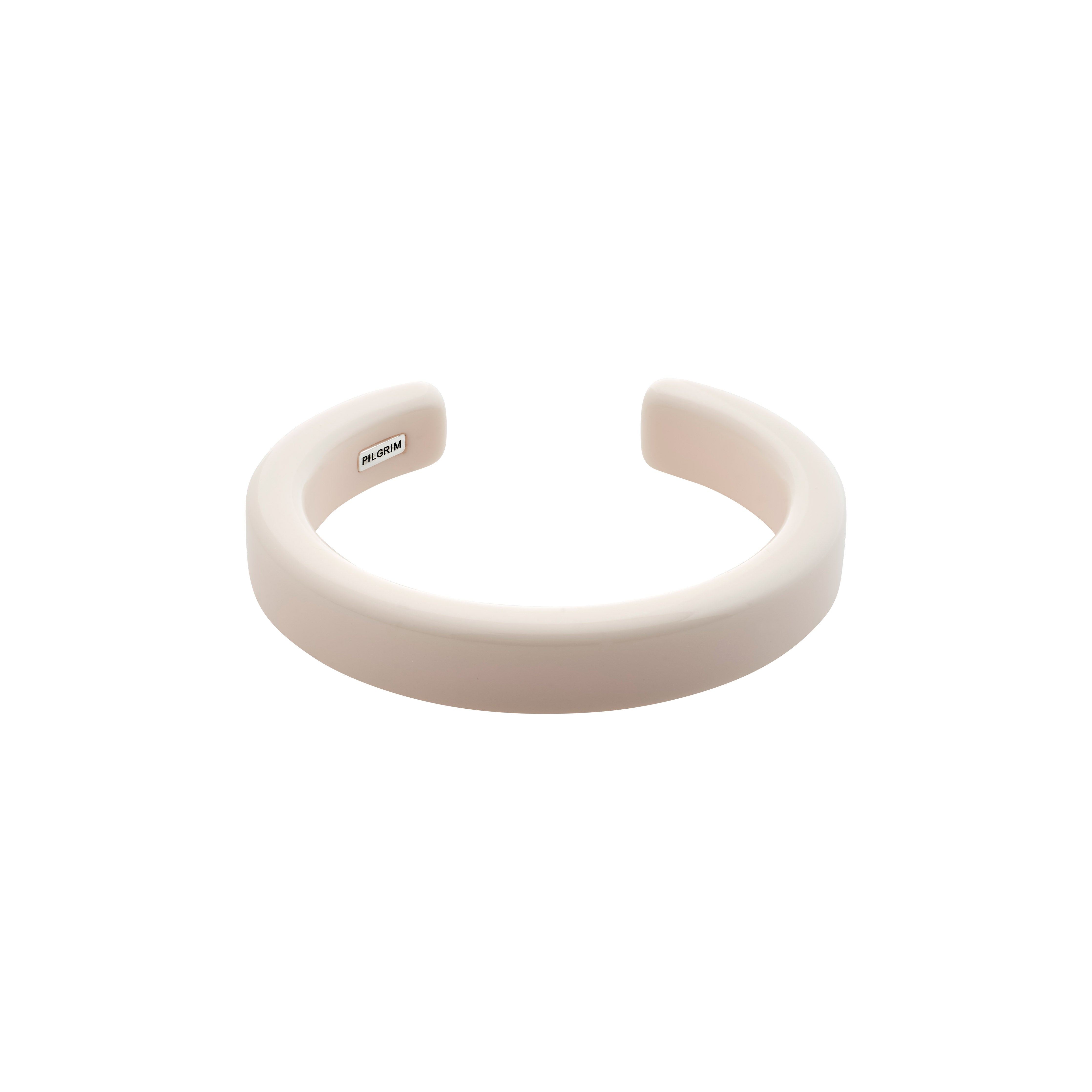 ECLIPSE bangle white, crafted from recycled acrylic, features a sleek design ideal for stacking, embodying Pilgrim's commitment to sustainable, stylish Danish jewelry.