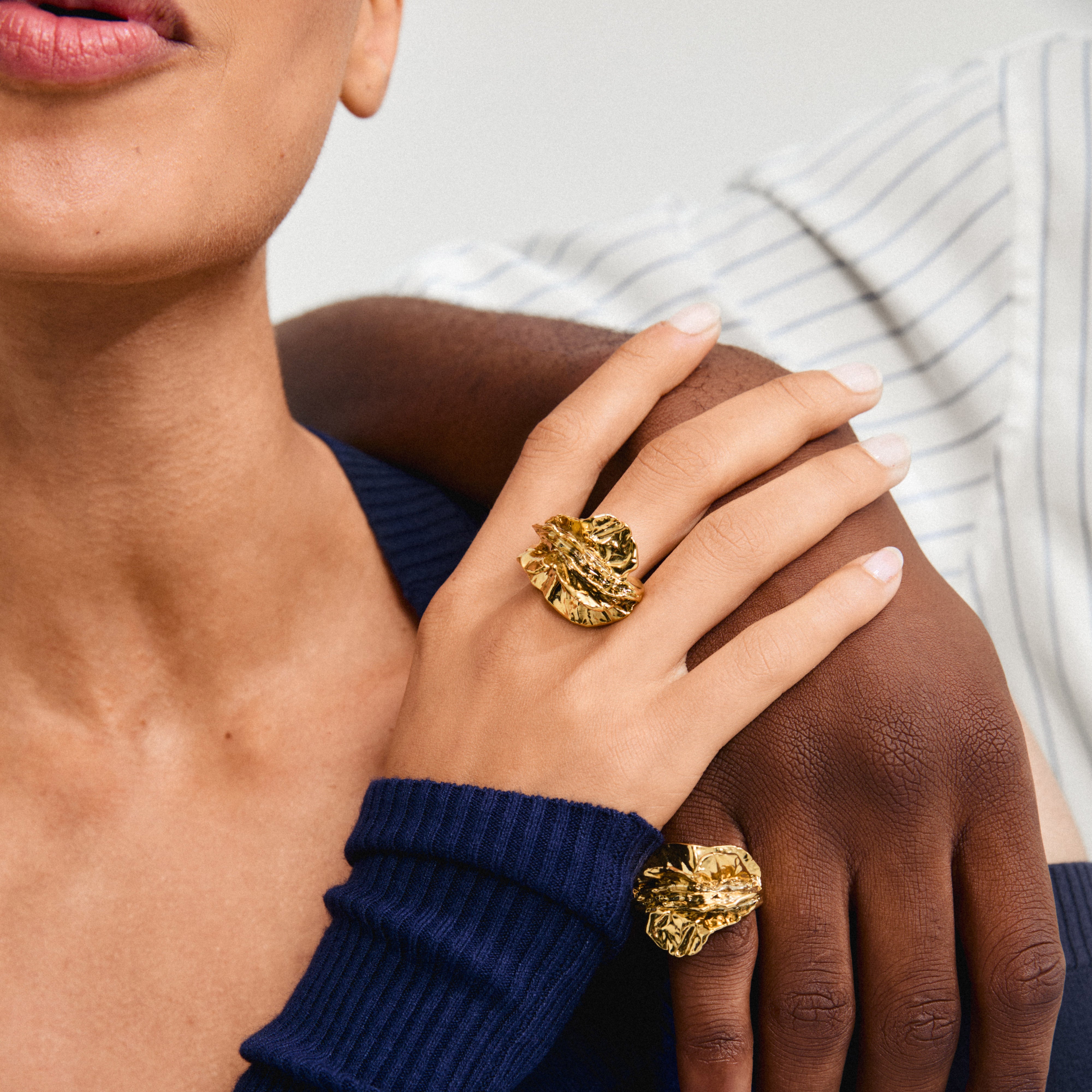 ECLIPSE ring gold-plated on woman's hand, showcasing its bold, organic design and adjustable fit, embodying Pilgrim's stylish and eco-conscious jewelry craftsmanship.