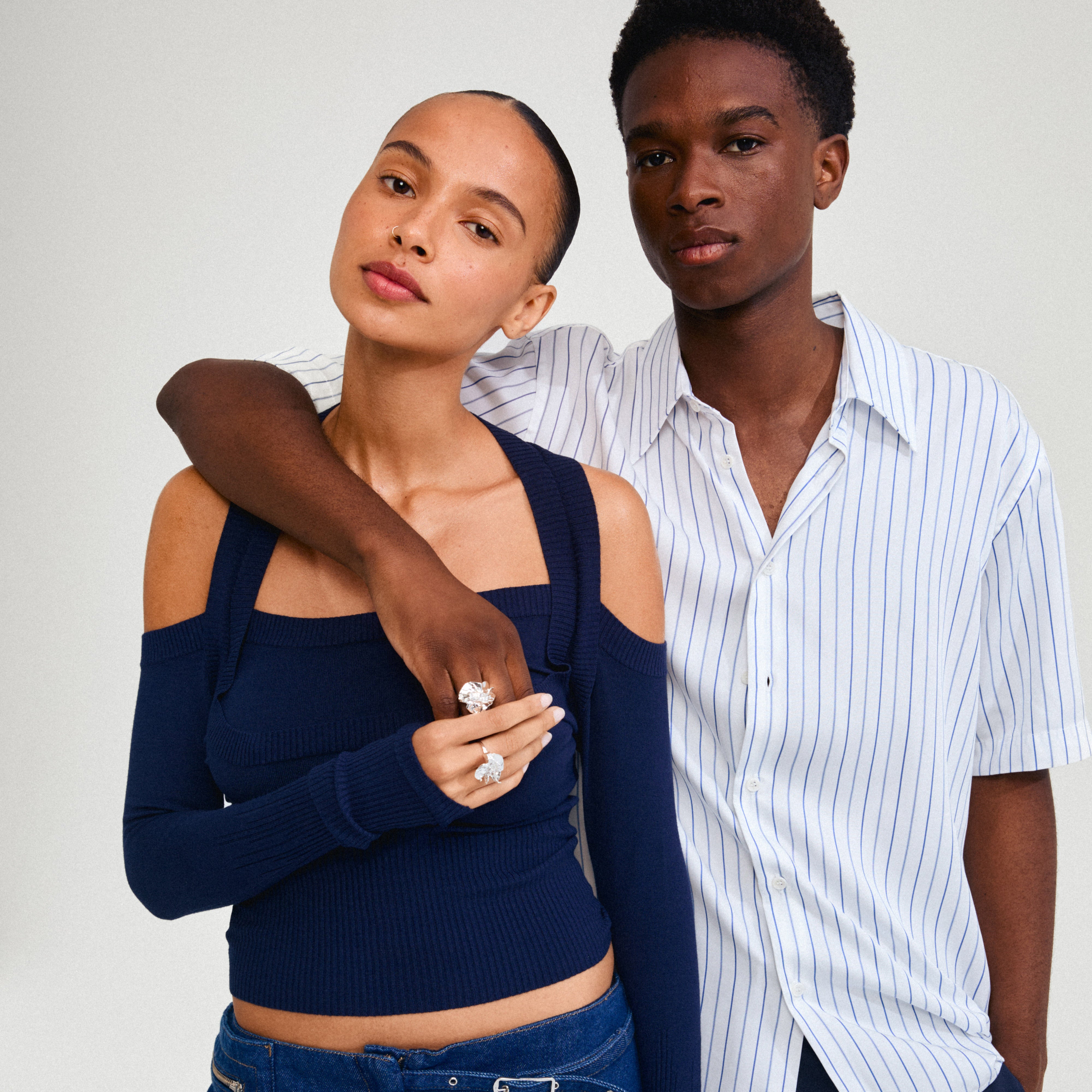 Man embracing woman, showcasing the silver-plated ECLIPSE ring from Pilgrim, known for its bold, organic design and crafted from 99% recycled materials.
