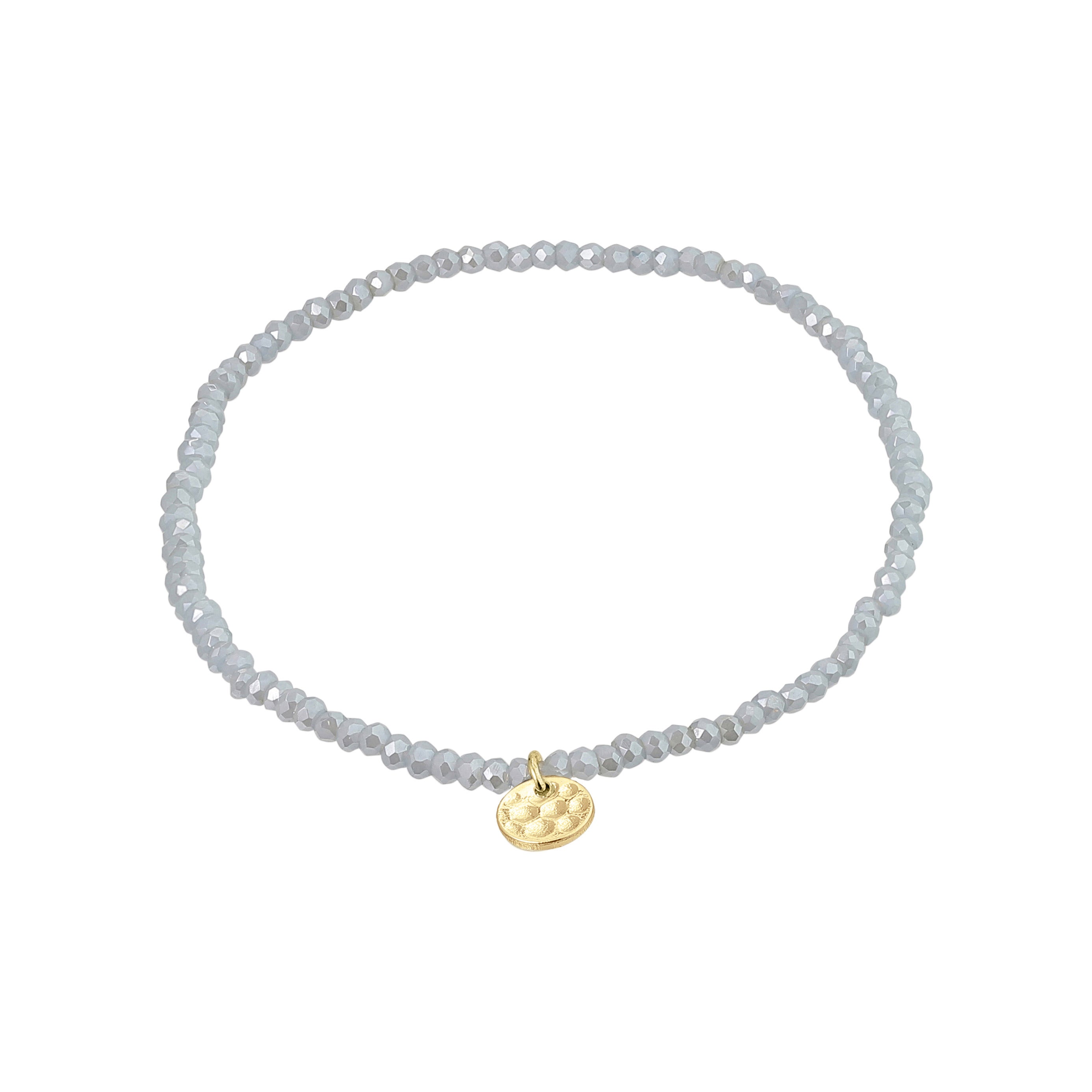 INDIE bracelet blue, gold-plated: a beaded bracelet featuring faceted glass beads and a discreet gold-plated Pilgrim logo charm, strung on durable Lycra elastic for versatile wear.