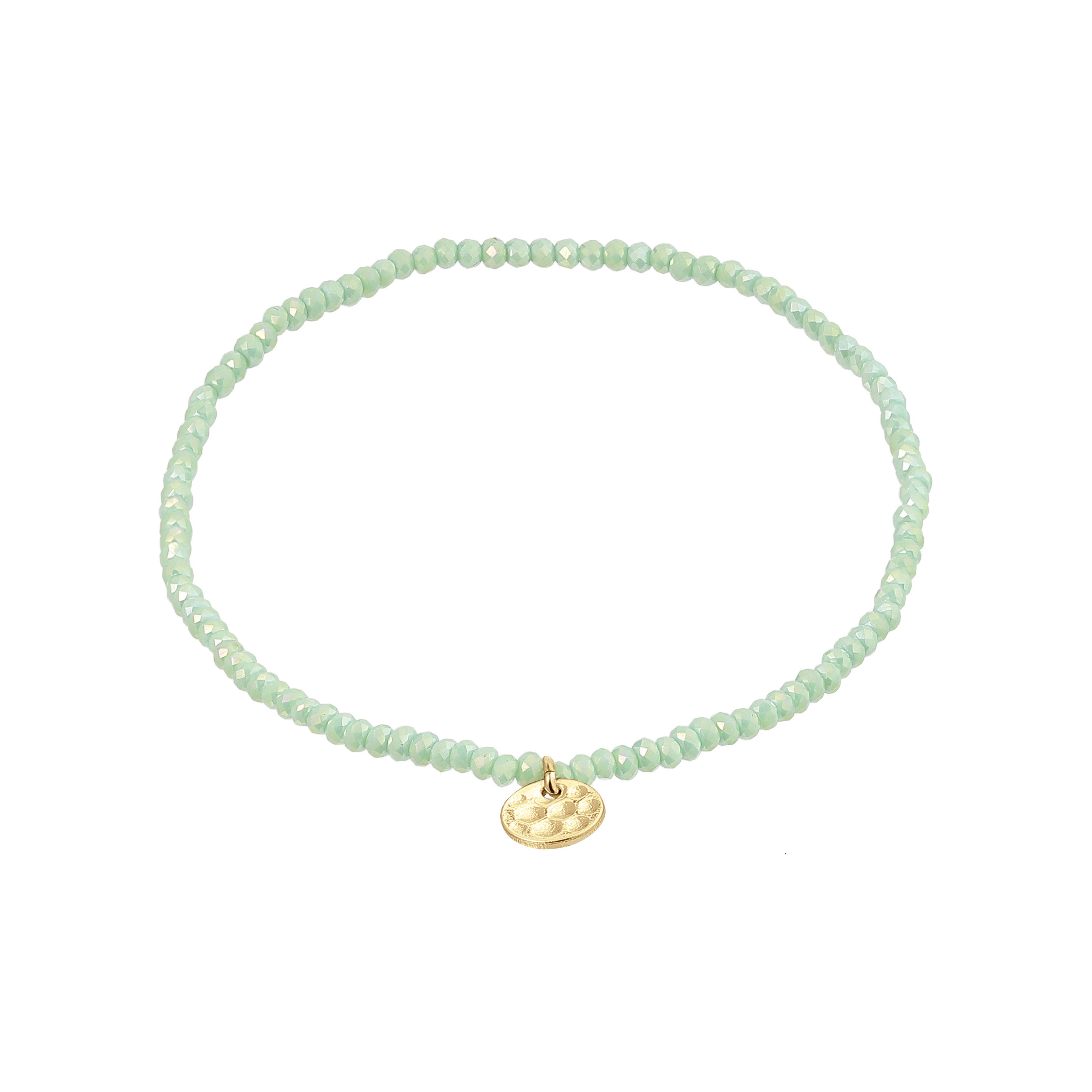 INDIE bracelet featuring aqua green faceted glass beads with a discreet gold-plated Pilgrim logo charm, crafted on durable Lycra elastic for versatile wrist fit.