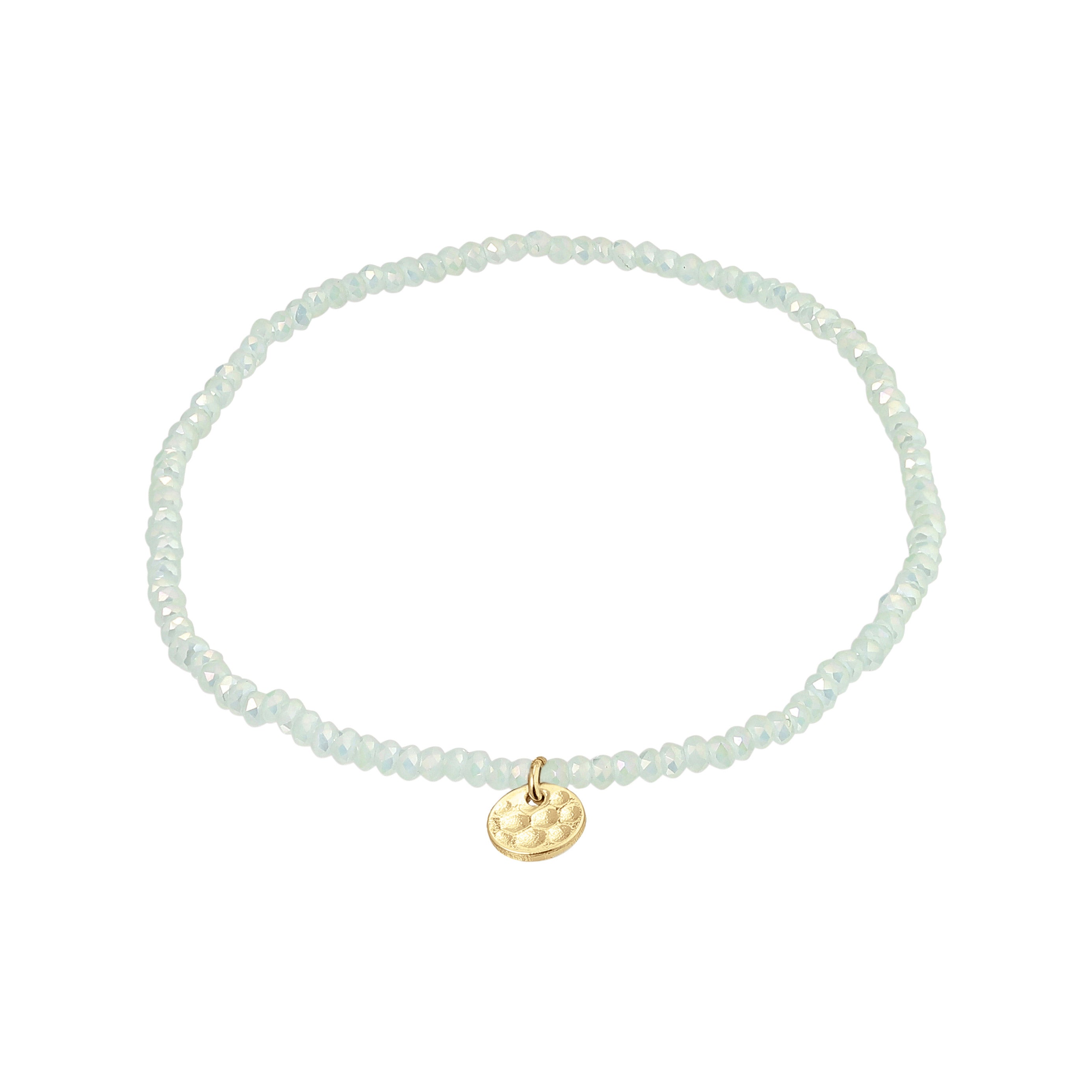 INDIE bracelet featuring gold-plated charm and mint glass beads, designed for versatile style on durable Lycra elastic. Perfect for layering with similar styles.