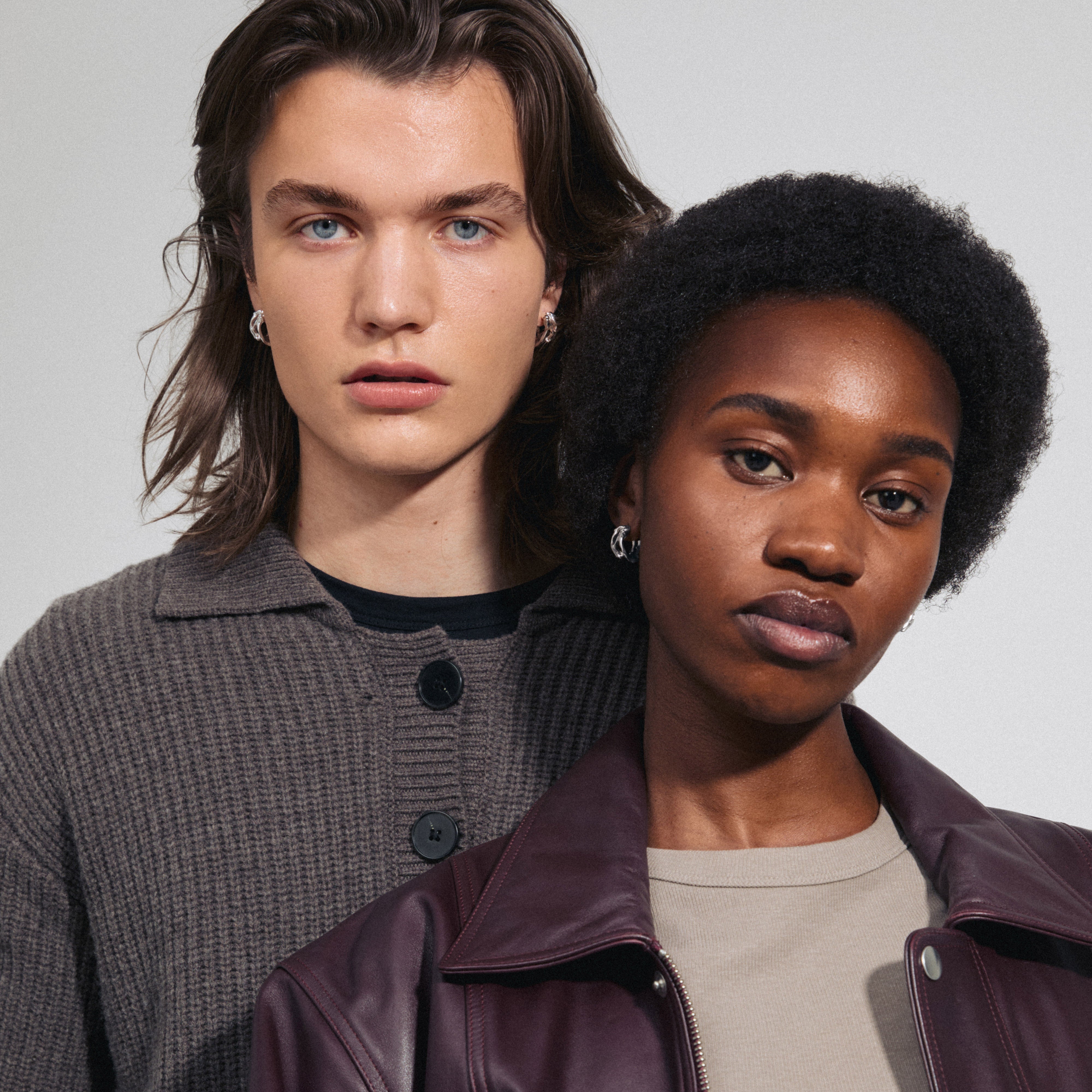 Silver-plated FOTINI hoop earrings on a woman, showcasing their organic design and elegance, embodying Pilgrim's handmade, trendy Danish jewellery appeal.