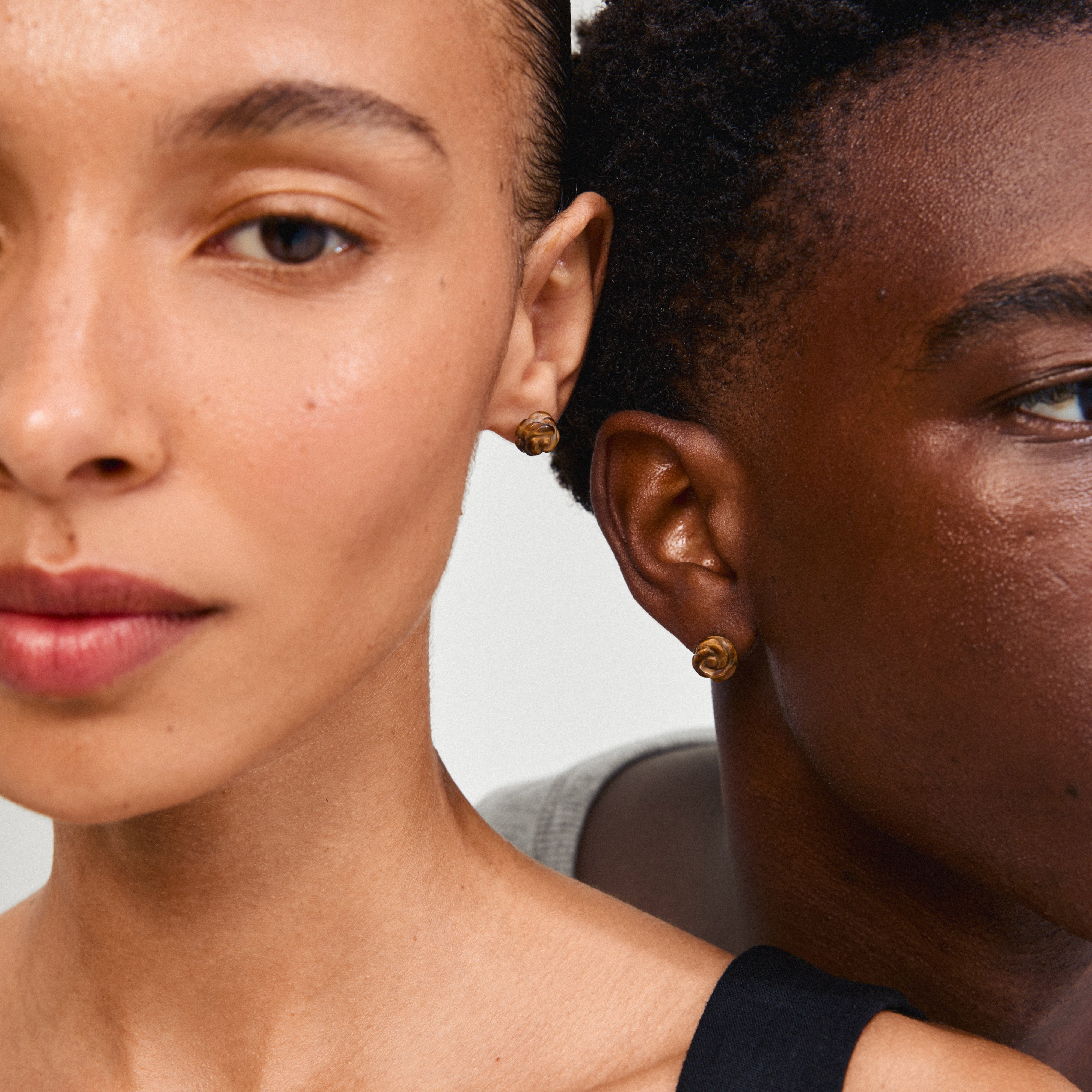 ADEM Tiger Eye earrings featuring intricately carved rose motifs, highlighting nature's elegance with semi-precious stones, perfect for personal style enhancement.