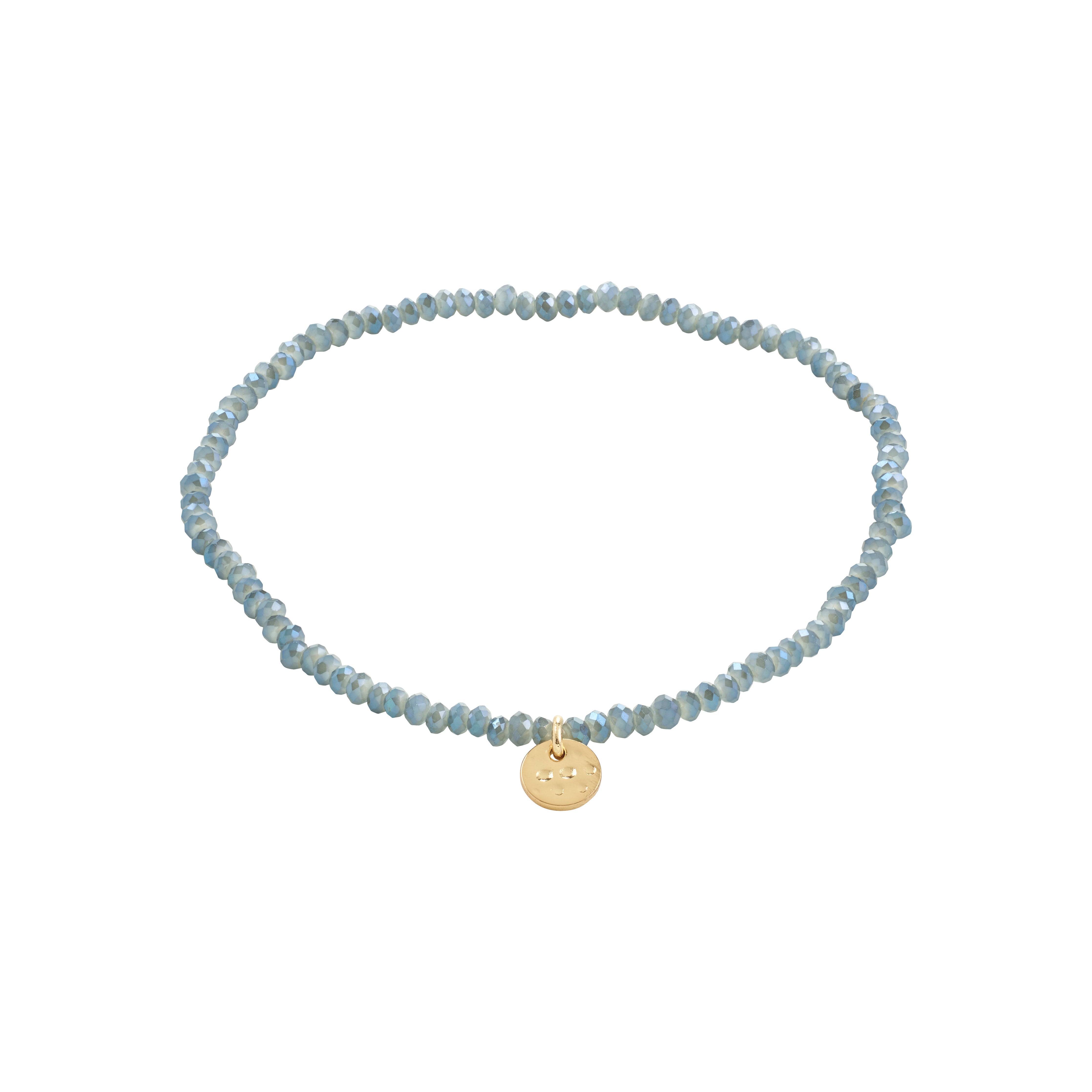 INDIE bracelet dusty blue: A blue beaded bracelet with a gold-plated disc, featuring faceted glass beads on elastic for versatile, stylish wear.