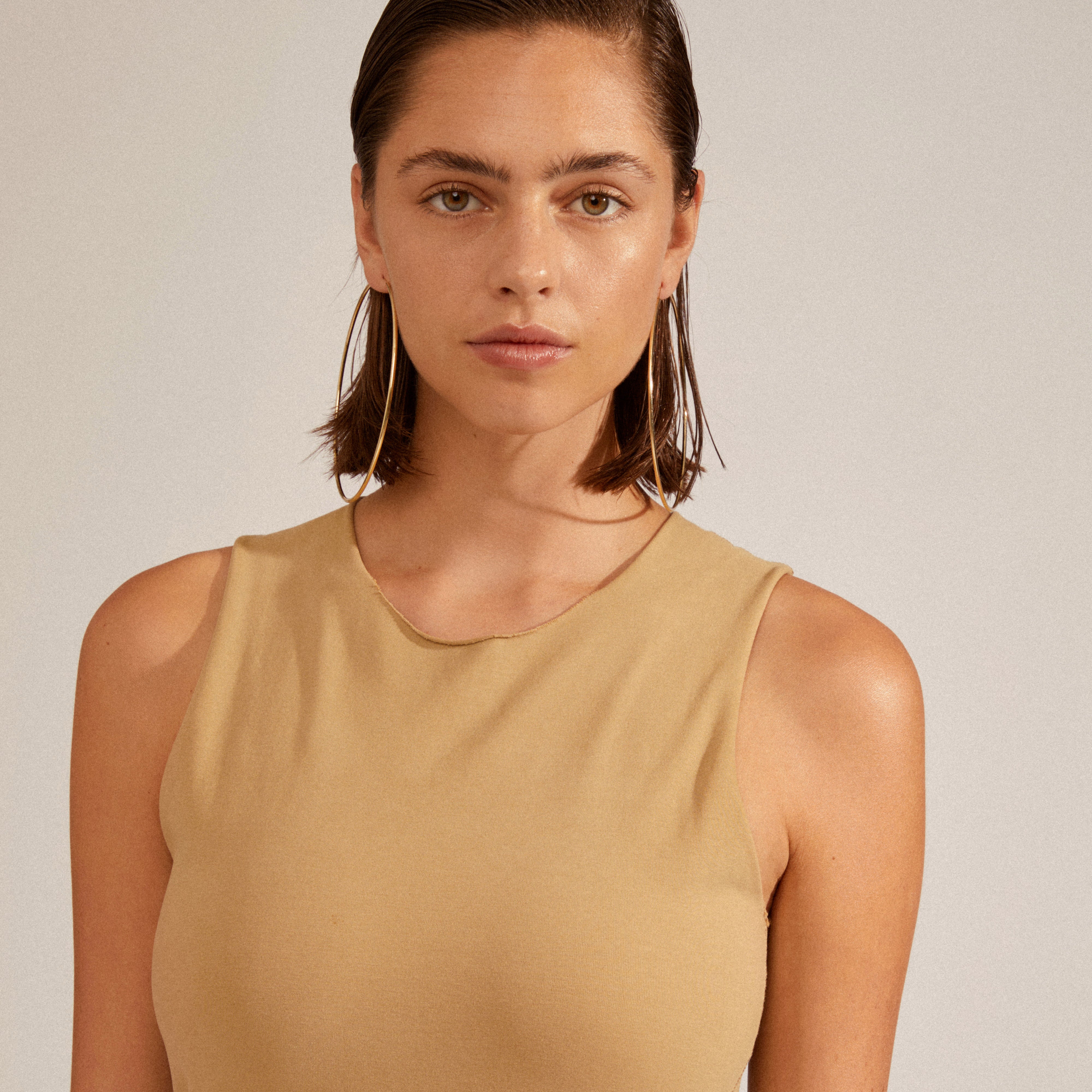 APRIL mega hoop earrings gold-plated, showcased in a close-up, highlighting their bold 100mm diameter and elegant, slim design for versatile styling.