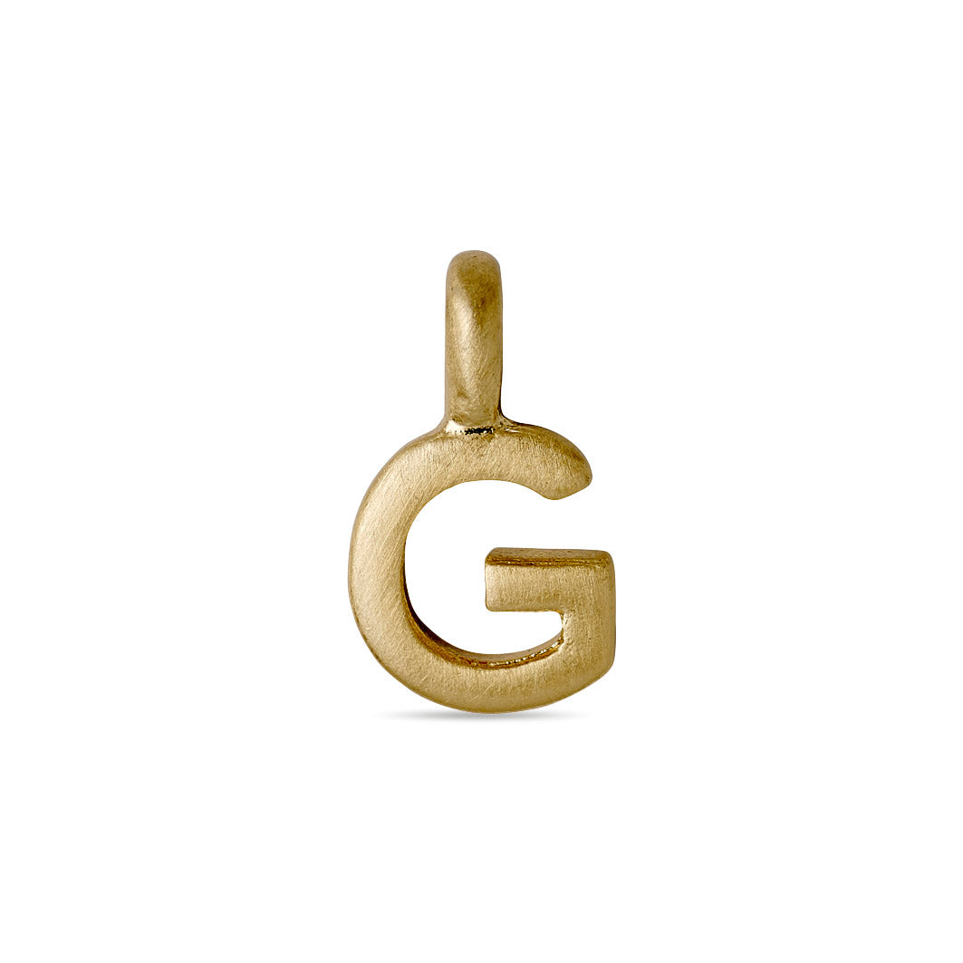 Gold-plated CHARM G pendant, ideal for personalizing jewelry. Perfect for layering or wearing solo, adding a bespoke touch to your collection.