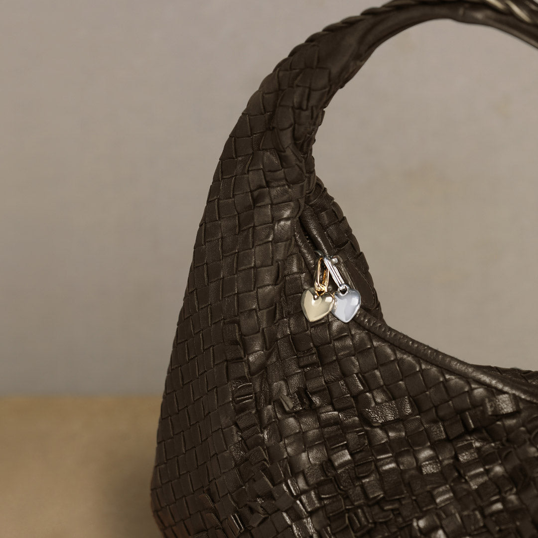 Gold-plated CHARM heart pendant by Pilgrim, shown up close, highlighting its shiny finish and intricate design, perfect for adding a personalized touch to your style.