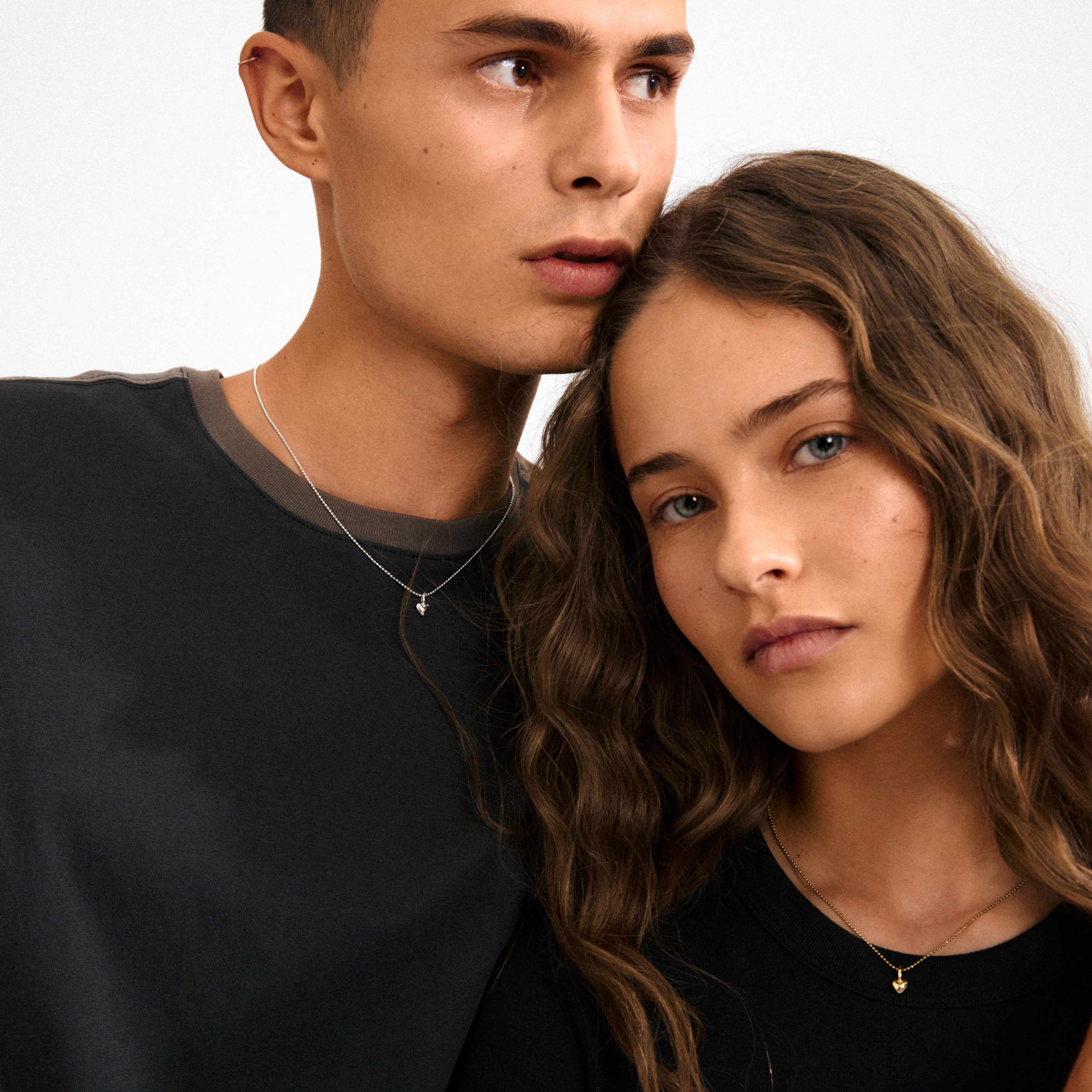 Gold-plated mini heart pendant from Pilgrim, ideal for personalized styling. Wear it solo or mix with charms for a unique, minimalist statement.