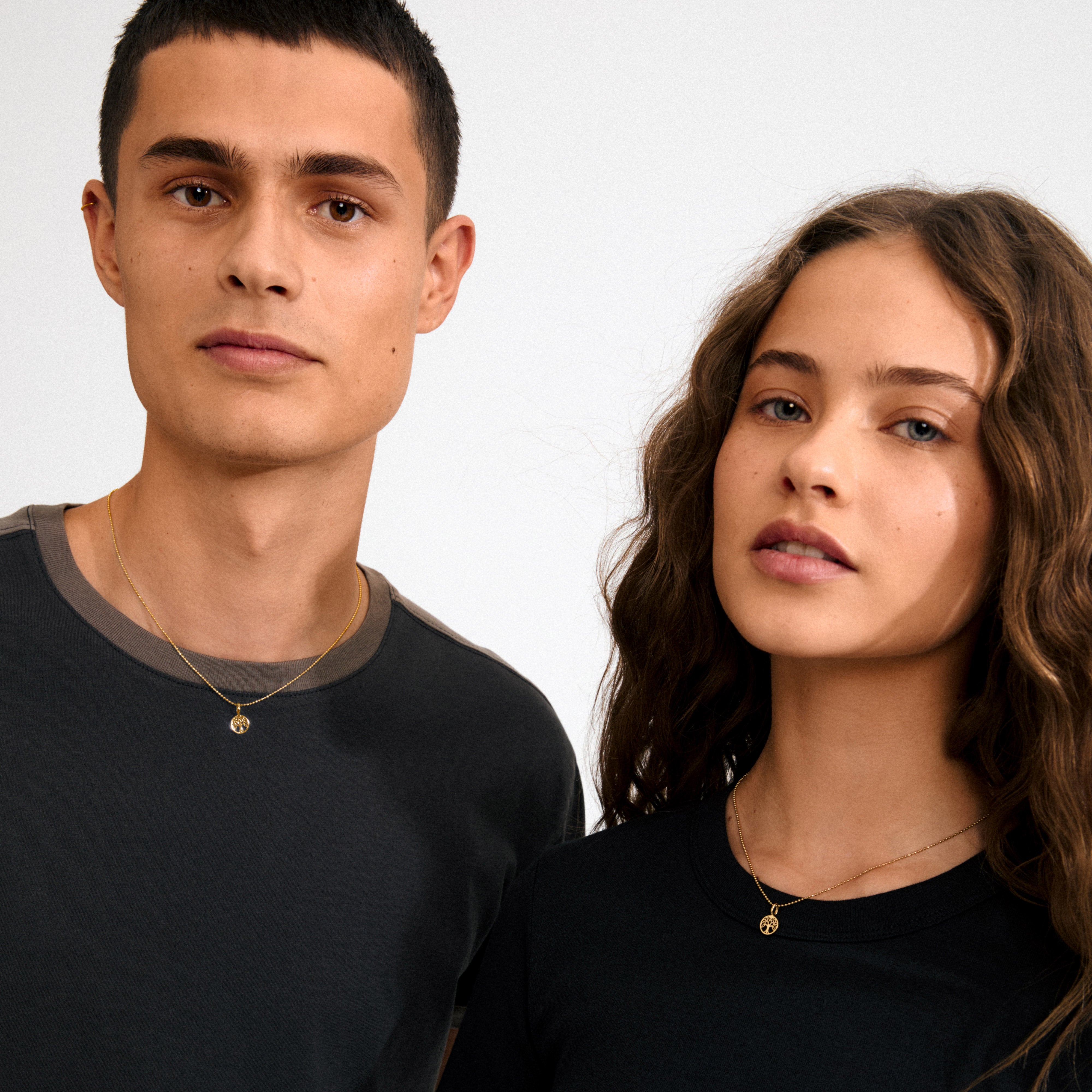 Gold-plated mini Tree of Life pendant, symbolizing growth and connection, with intricate details, crafted from recycled materials for necklaces or bracelets.