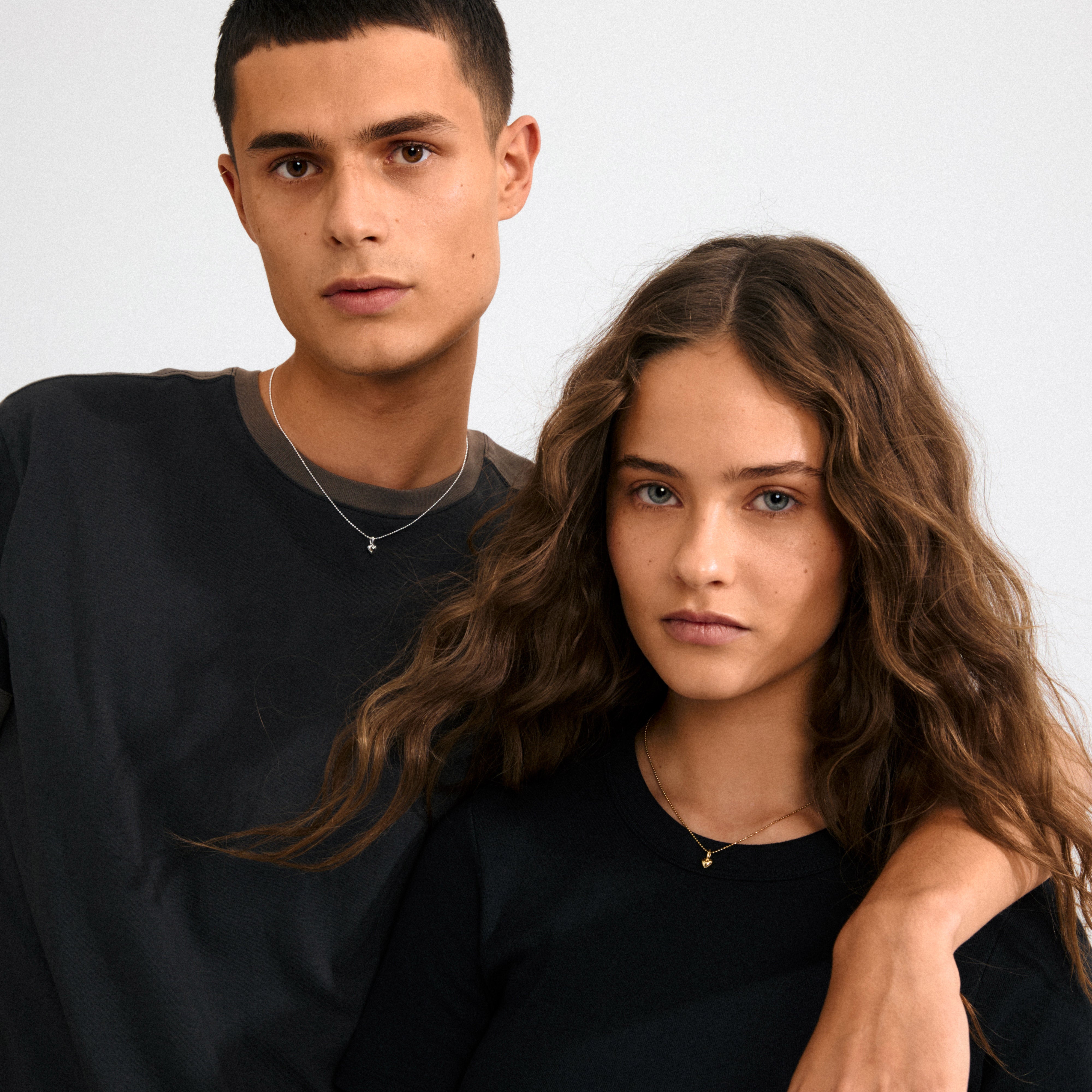 Silver-plated CHARM mini heart pendant, crafted from 99% recycled materials. Perfect for minimalist or layered looks, reflecting personal style with eco-conscious fashion.
