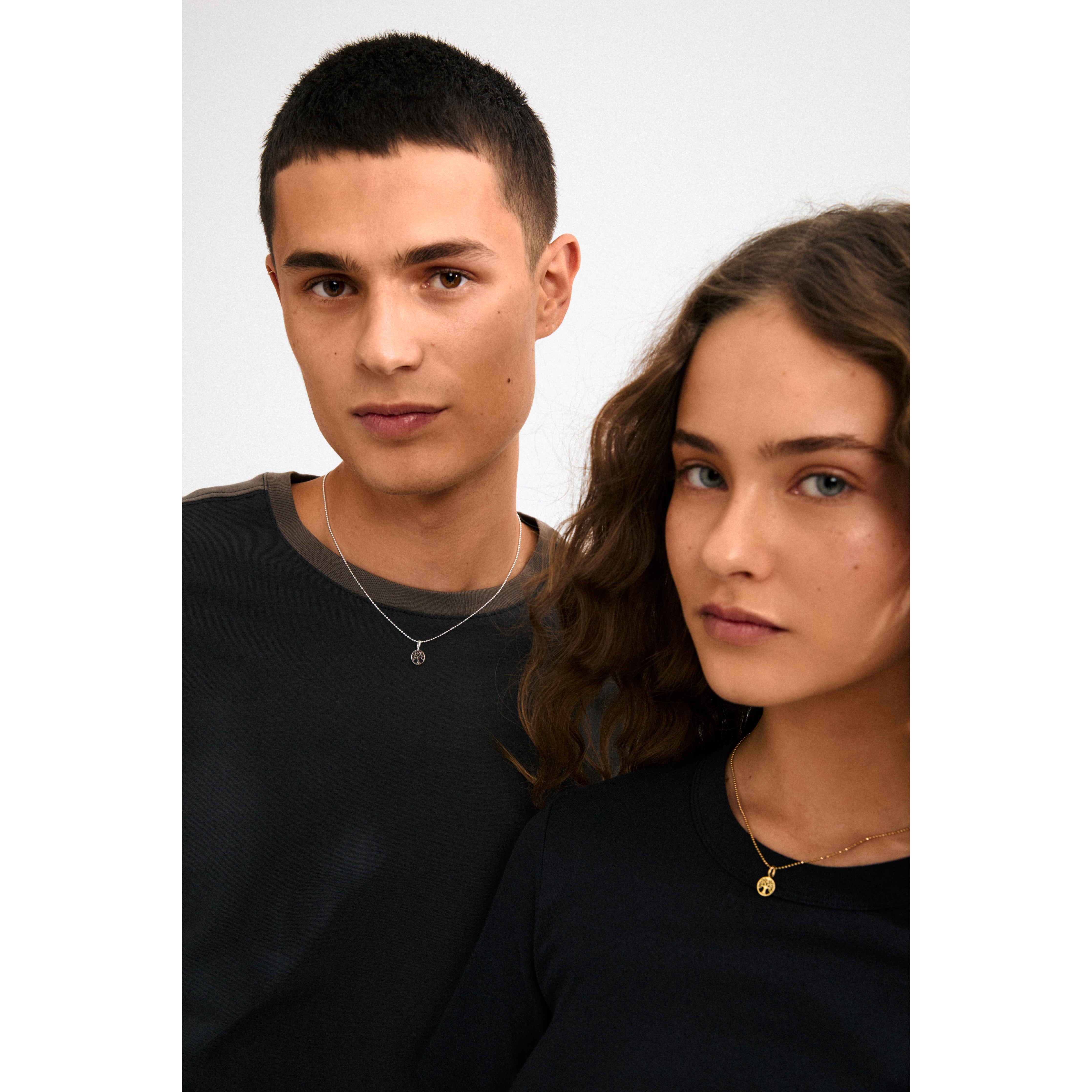 Silver-plated CHARM mini tree of life pendant symbolizing growth and connection, crafted from recycled materials for a personal, eco-friendly style.