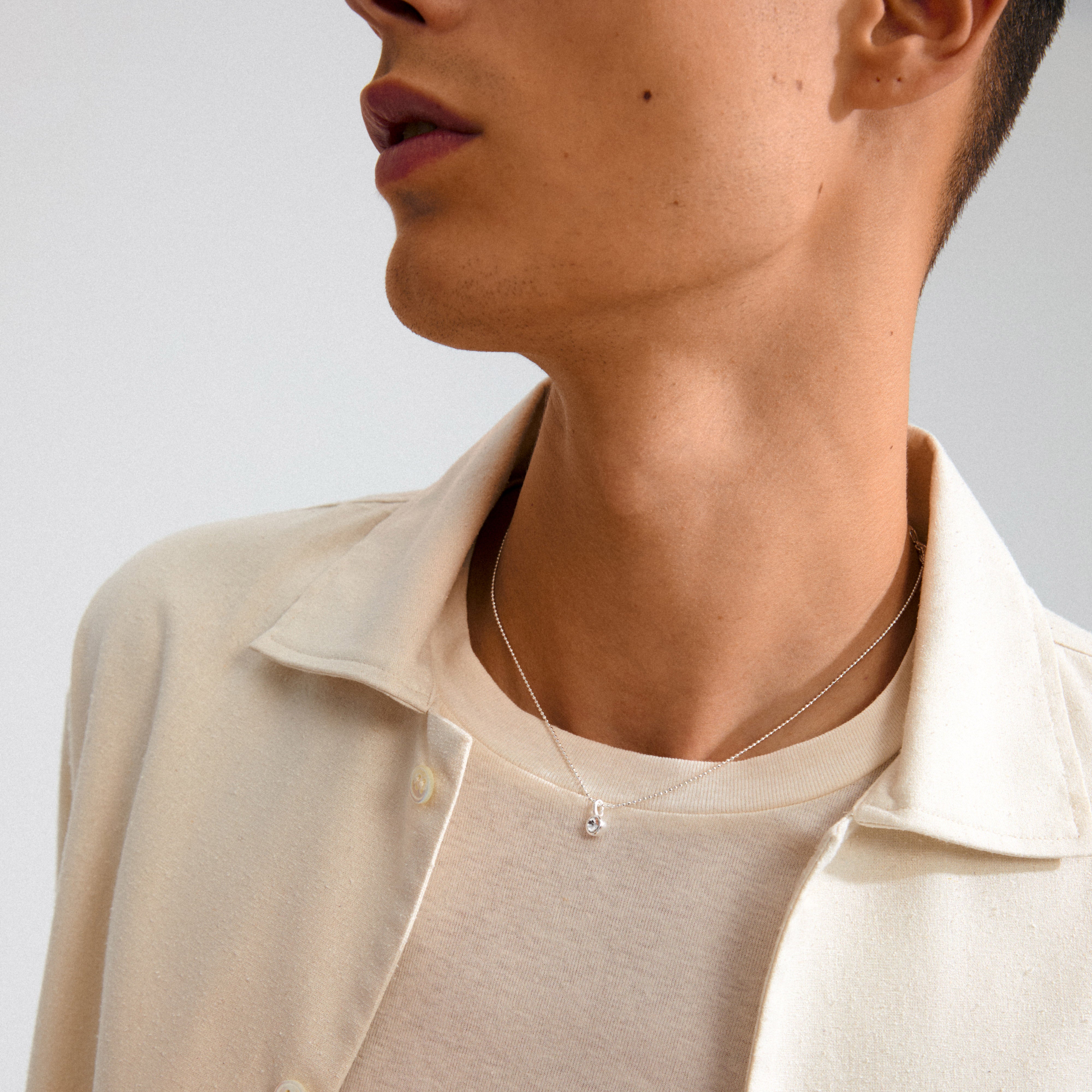 Silver-plated mini crystal pendant, perfect for personalizing hoops or necklaces. Crafted with 85% recycled materials, blending minimalist charm with eco-conscious style.