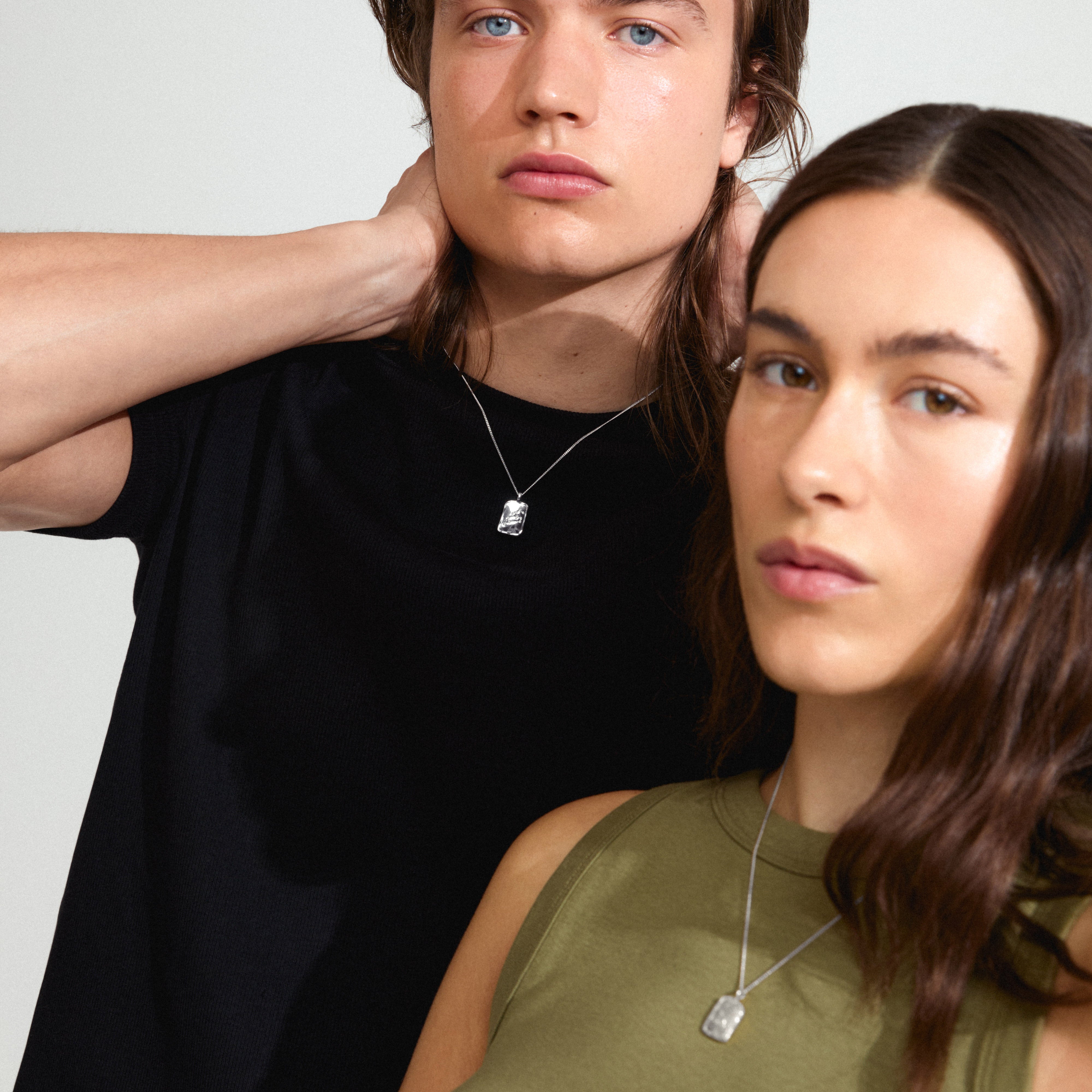 LEO Zodiac Sign necklace, silver-plated, featuring a dual-design square coin pendant with Leo motif and sparkling constellation, exuding a rustic, genderless style.