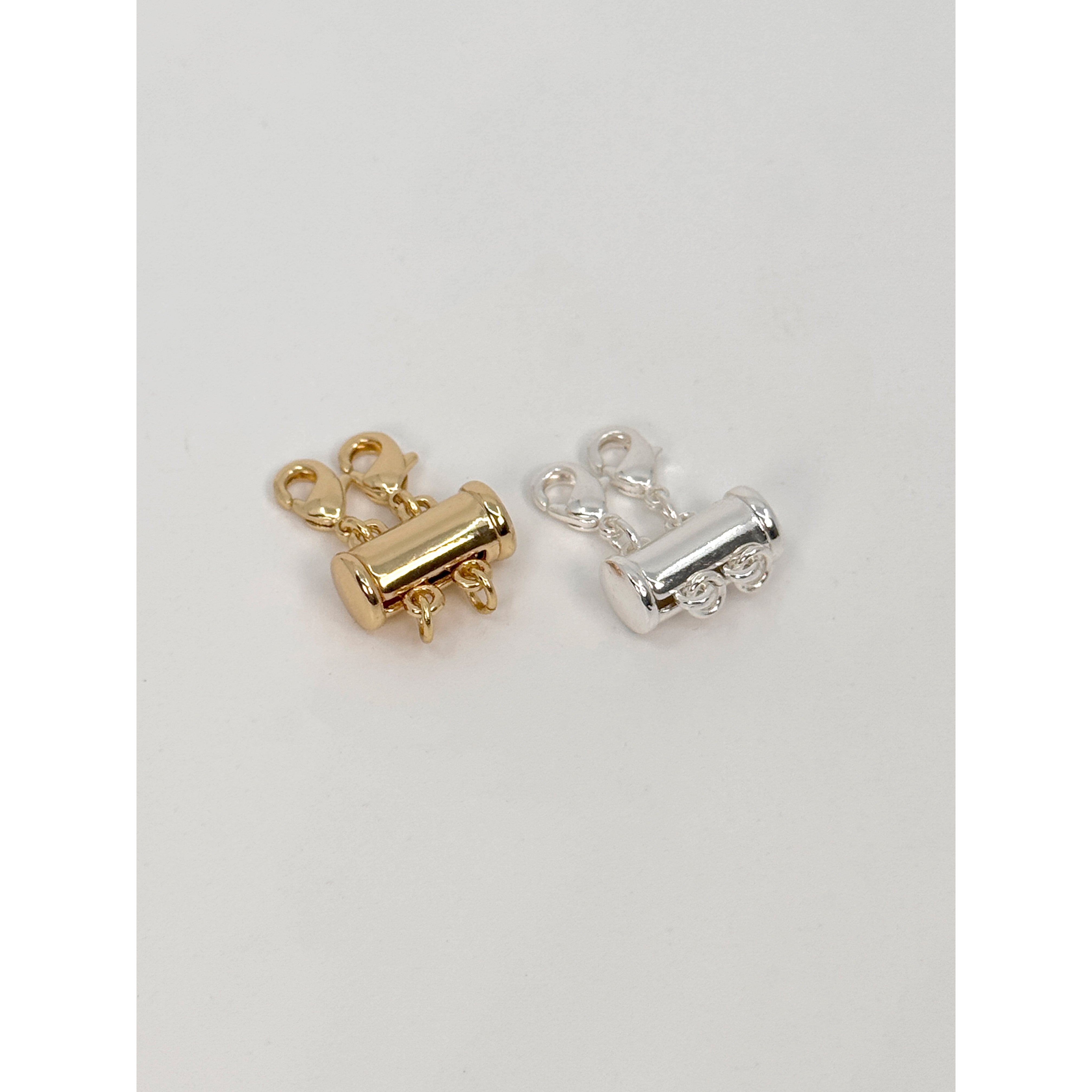 Silver-plated lock with two lobster clasps for layering necklaces, preventing tangling. Ideal for creating a stylish, layered look.