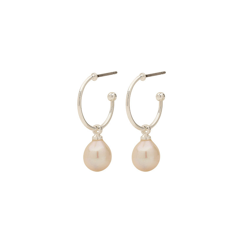 EILA pearl earrings, silver-plated hoops with pearl drops, embody timeless elegance and modern design, perfect for trendsetters seeking sophisticated, versatile accessories.