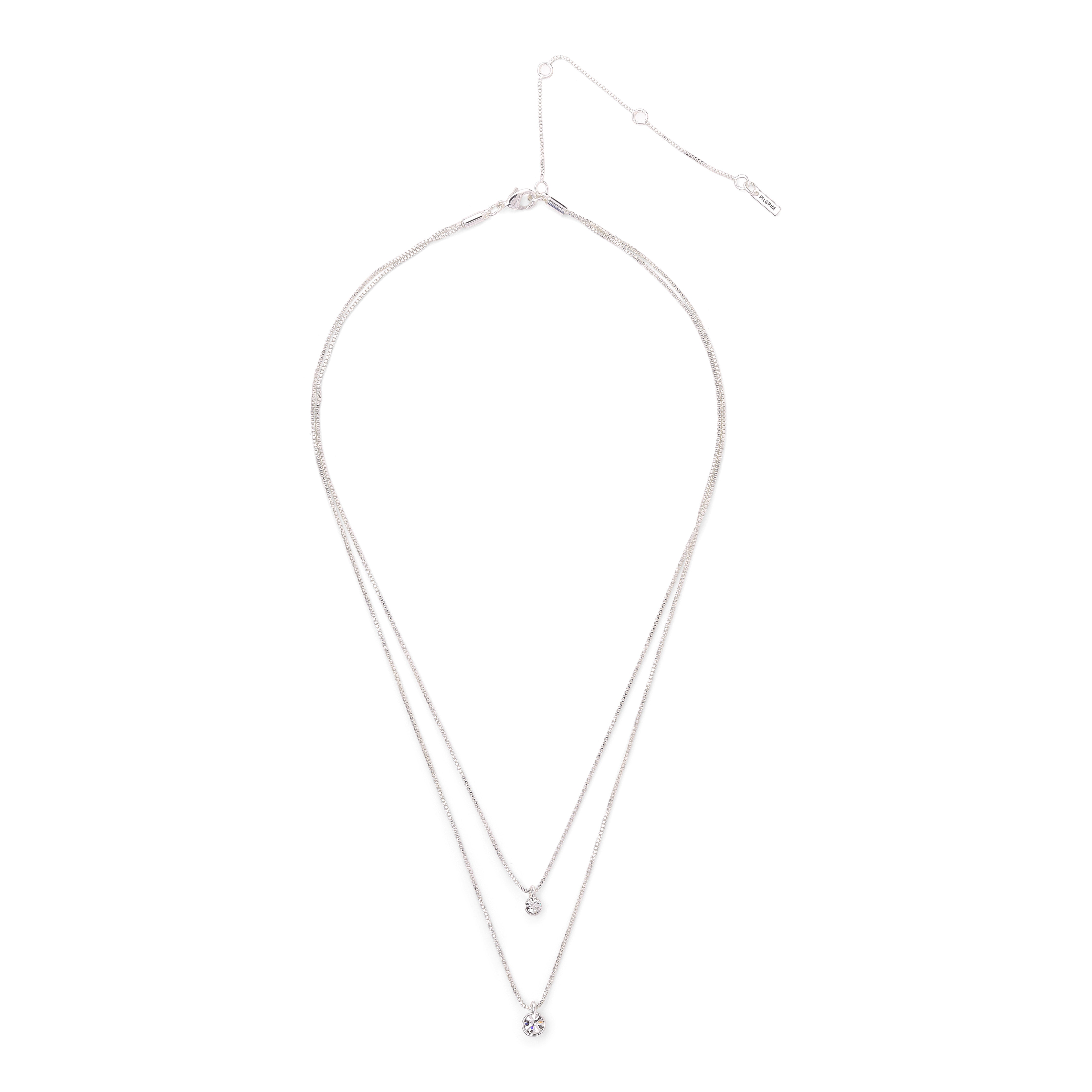 LUCIA 2-in-1 crystal necklace silver-plated, featuring dual chains with sparkling crystal pendants, elegantly designed to highlight the décolleté.