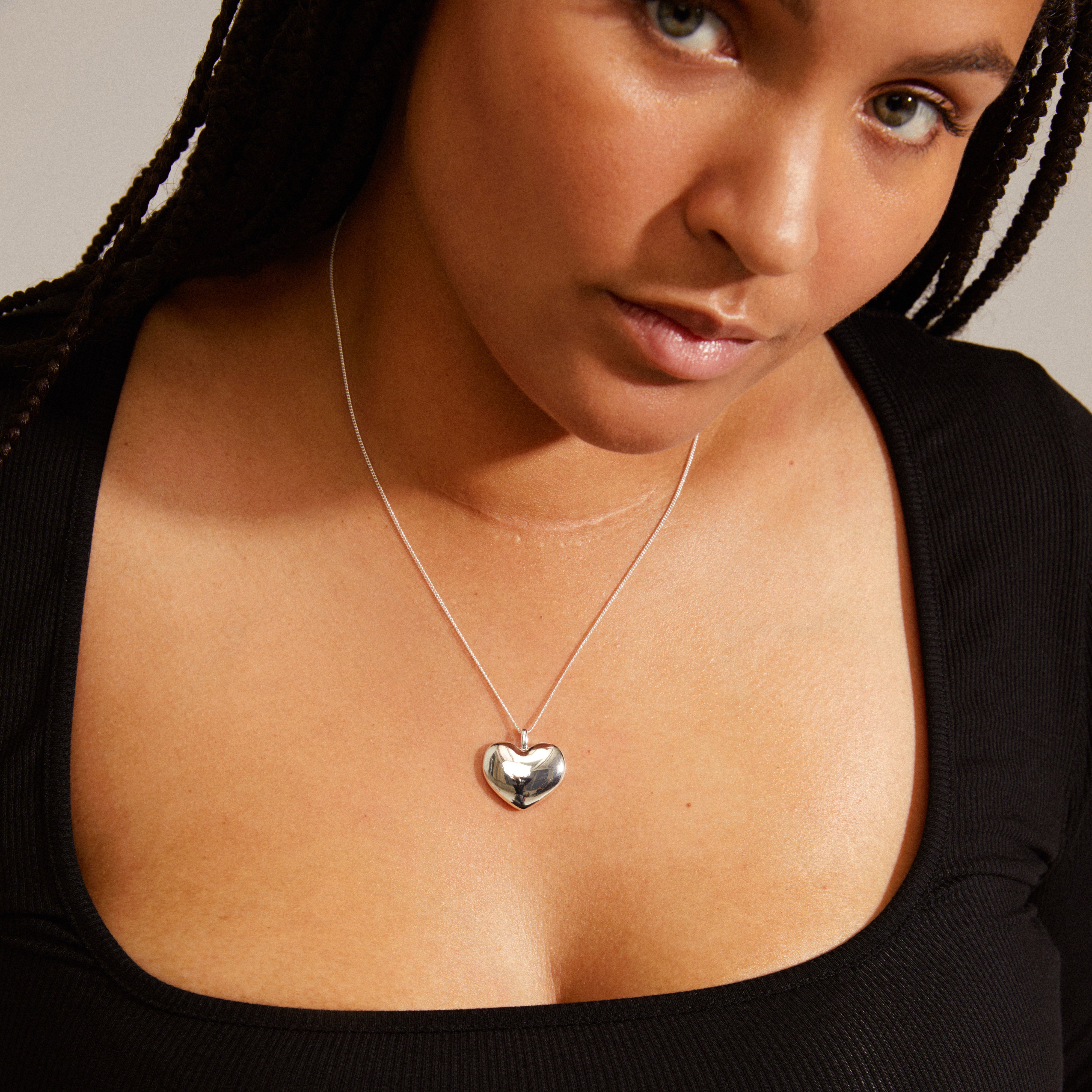 SOPHIA heart pendant necklace, silver-plated, worn by a woman, featuring a classic heart design on an adjustable chain, from Pilgrim's recycled SOPHIA series.