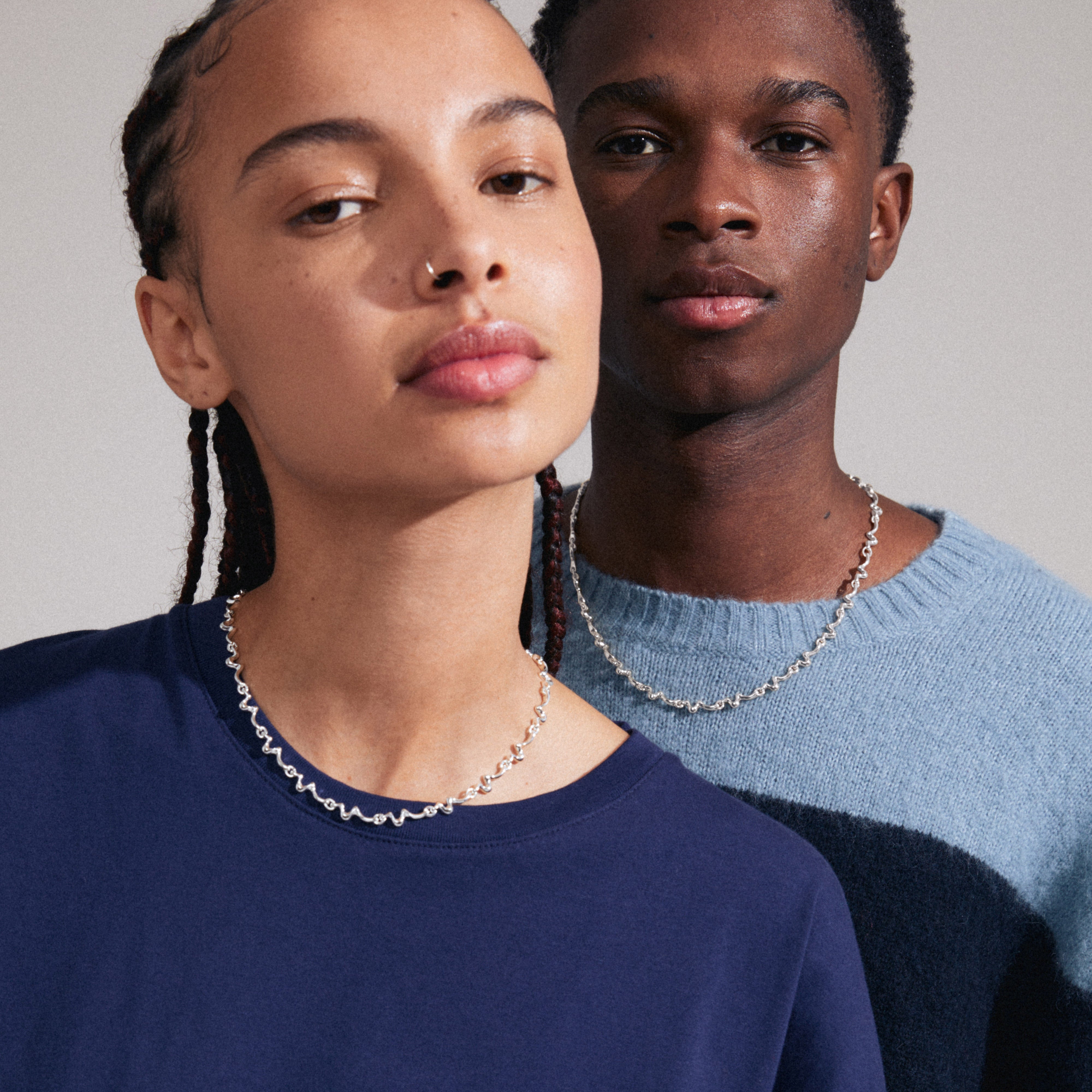 PENELOPE necklace silver-plated showcased on a woman, highlighting its wavy design and graphic silhouette. An elegant, scandi-style accessory from Pilgrim.
