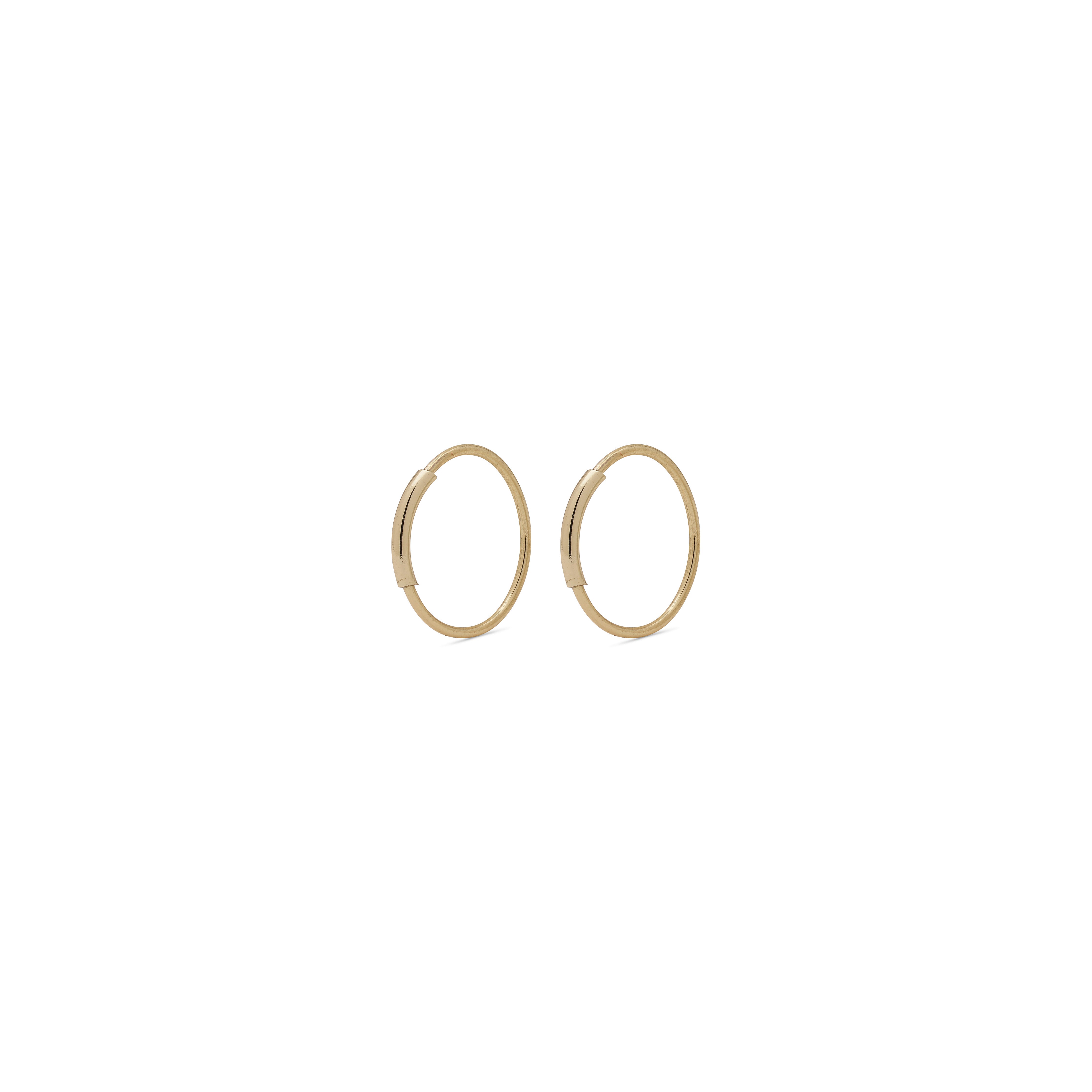 RAQUEL x-small gold-plated hoop earrings with an intriguing extra detail on the outer ring, perfect for versatile styling and modern elegance.