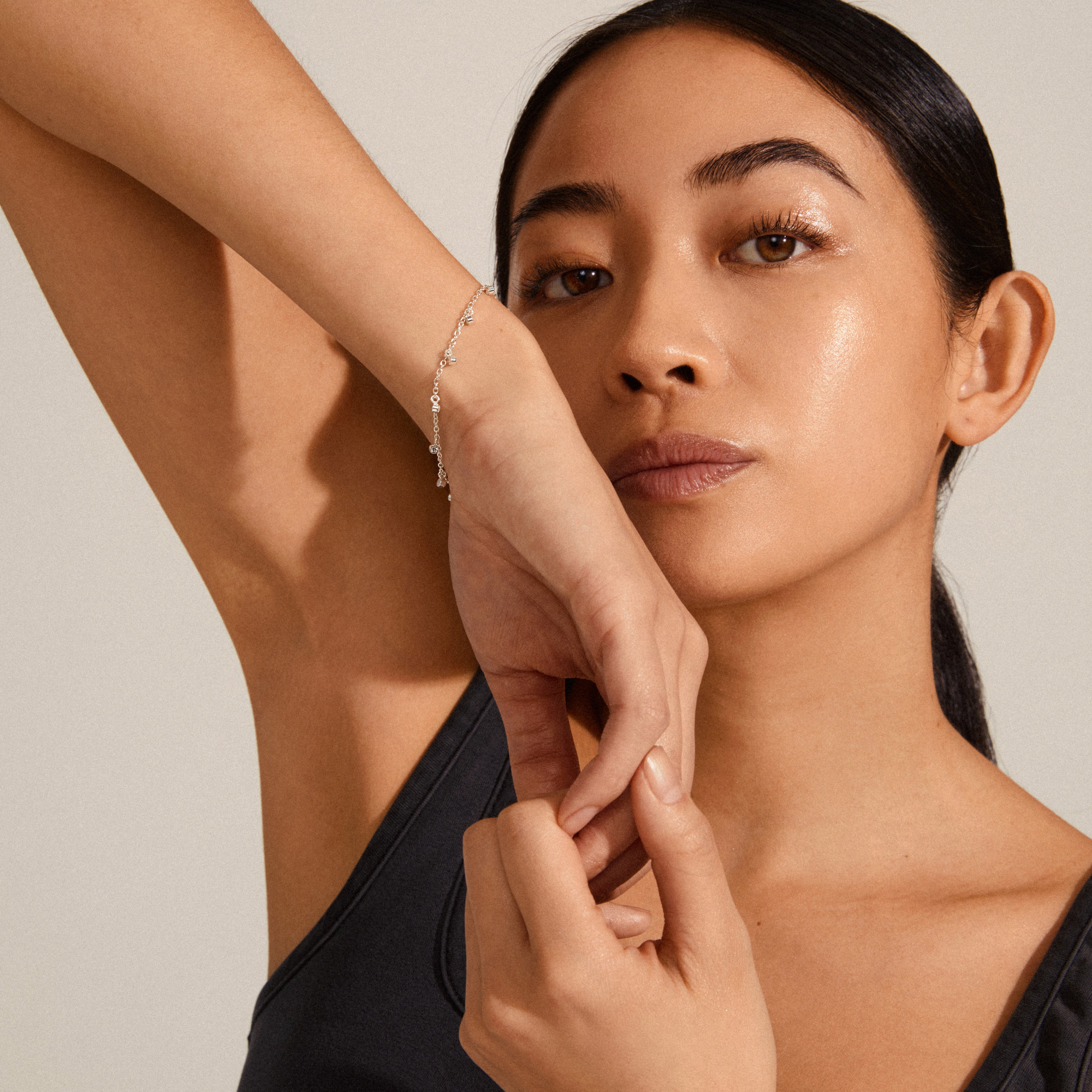 MAJA crystal multi drops bracelet silver-plated showcased on a woman's wrist, highlighting its elegant charm and sparkling crystal details in a close-up view.