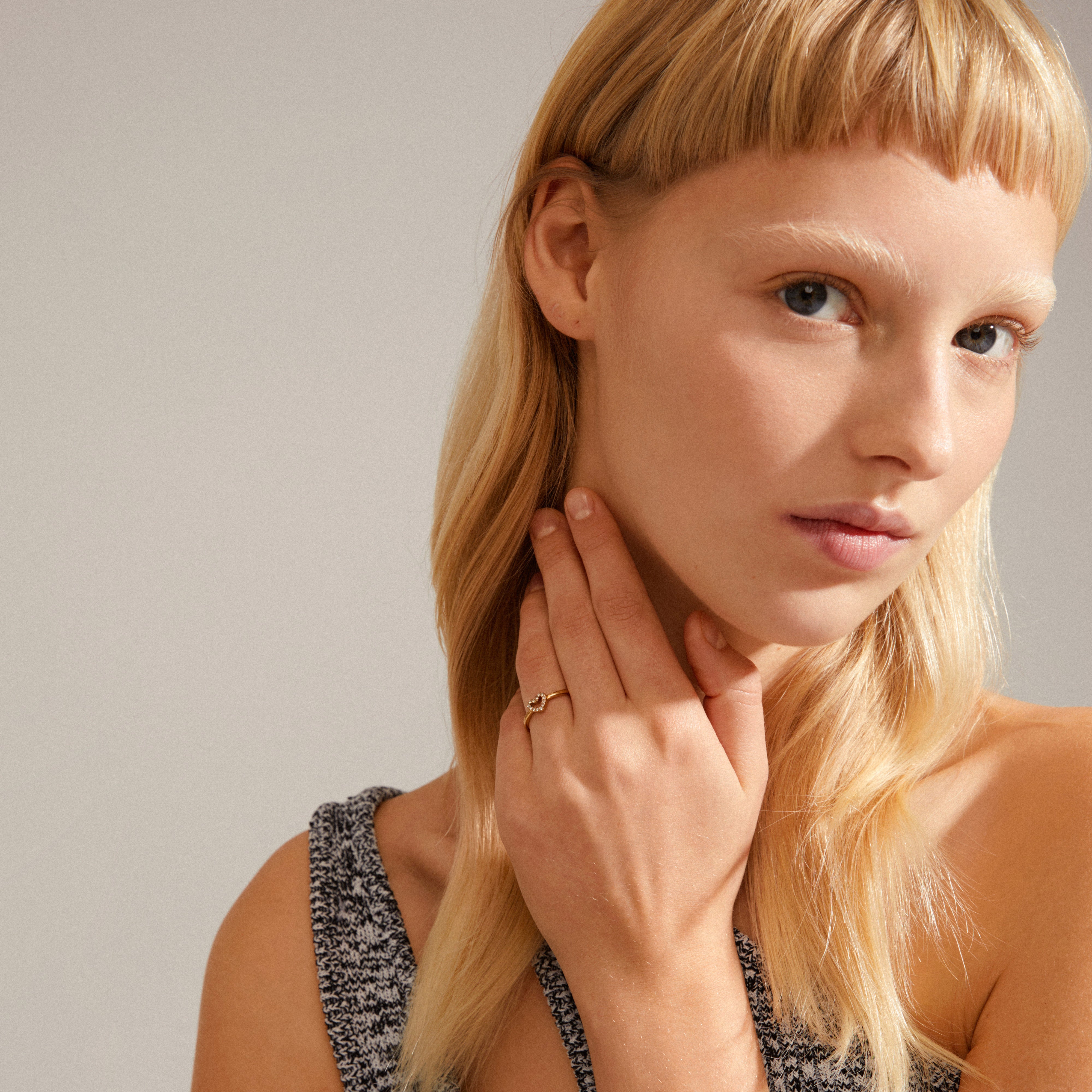 LULU crystal heart stack ring gold-plated on a woman's hand, offering a romantic, stackable design from Pilgrim's collection, enhancing personal style with timeless elegance.