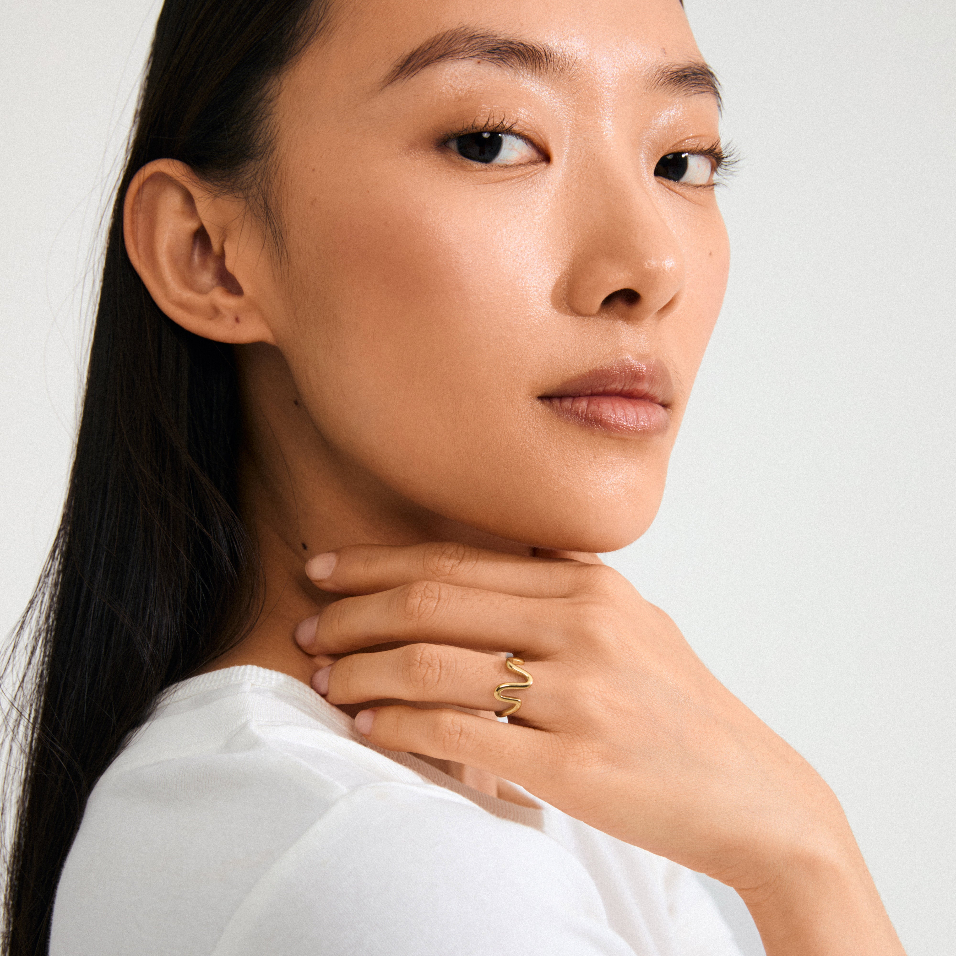Gold-plated LULU wavy stack ring with an organic, wavy design, ideal for solo or stacked wear, crafted from 99% recycled materials.
