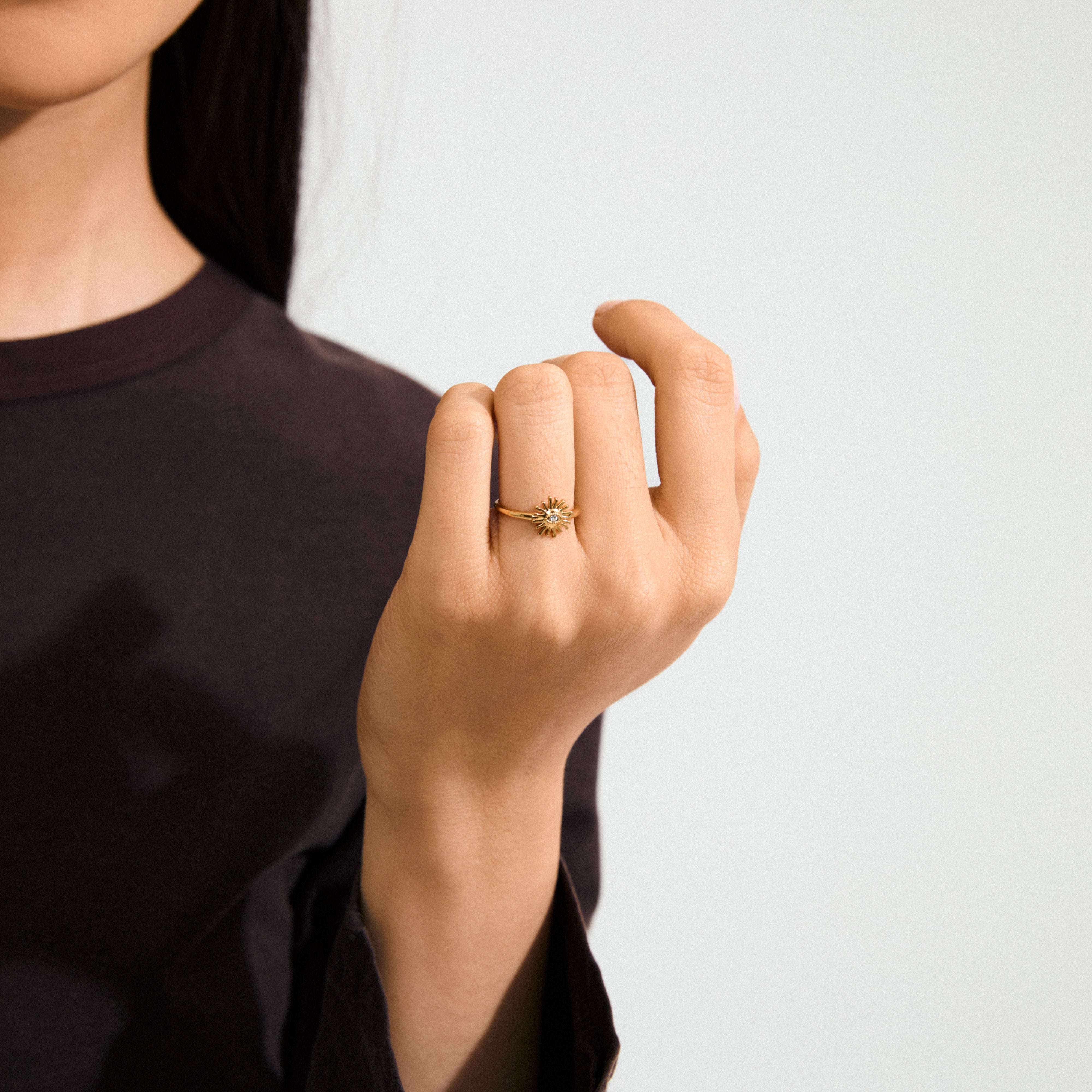 Gold-plated LULU sun stack ring by Pilgrim, featuring a sun design with a central crystal eye, perfect for making a subtle or stacked statement.