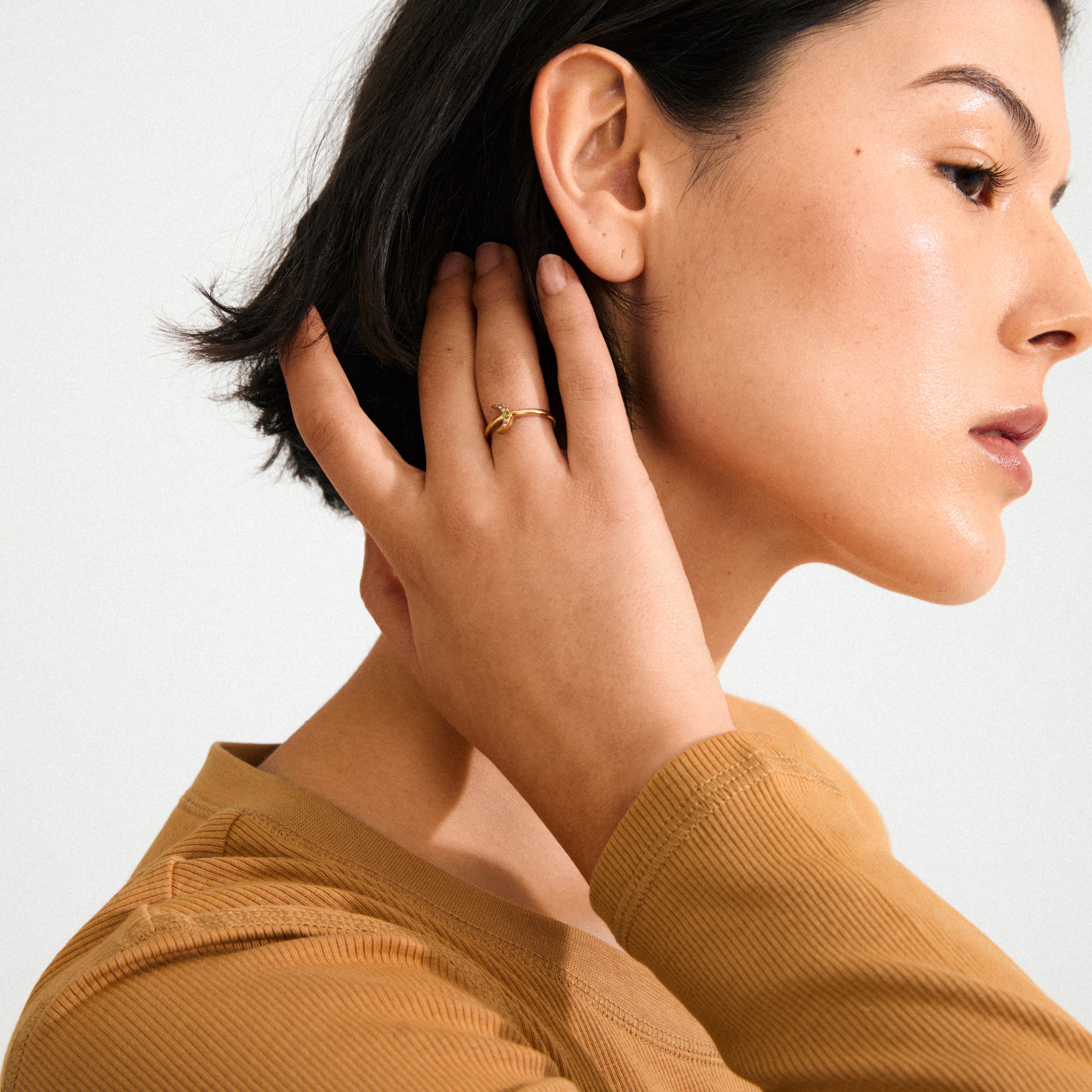 LULU moon stack ring, gold-plated, featuring a sparkling half-moon with small crystals, reflecting light beautifully. Made of 98% recycled material, waterproof, perfect for stylish, conscious wear.
