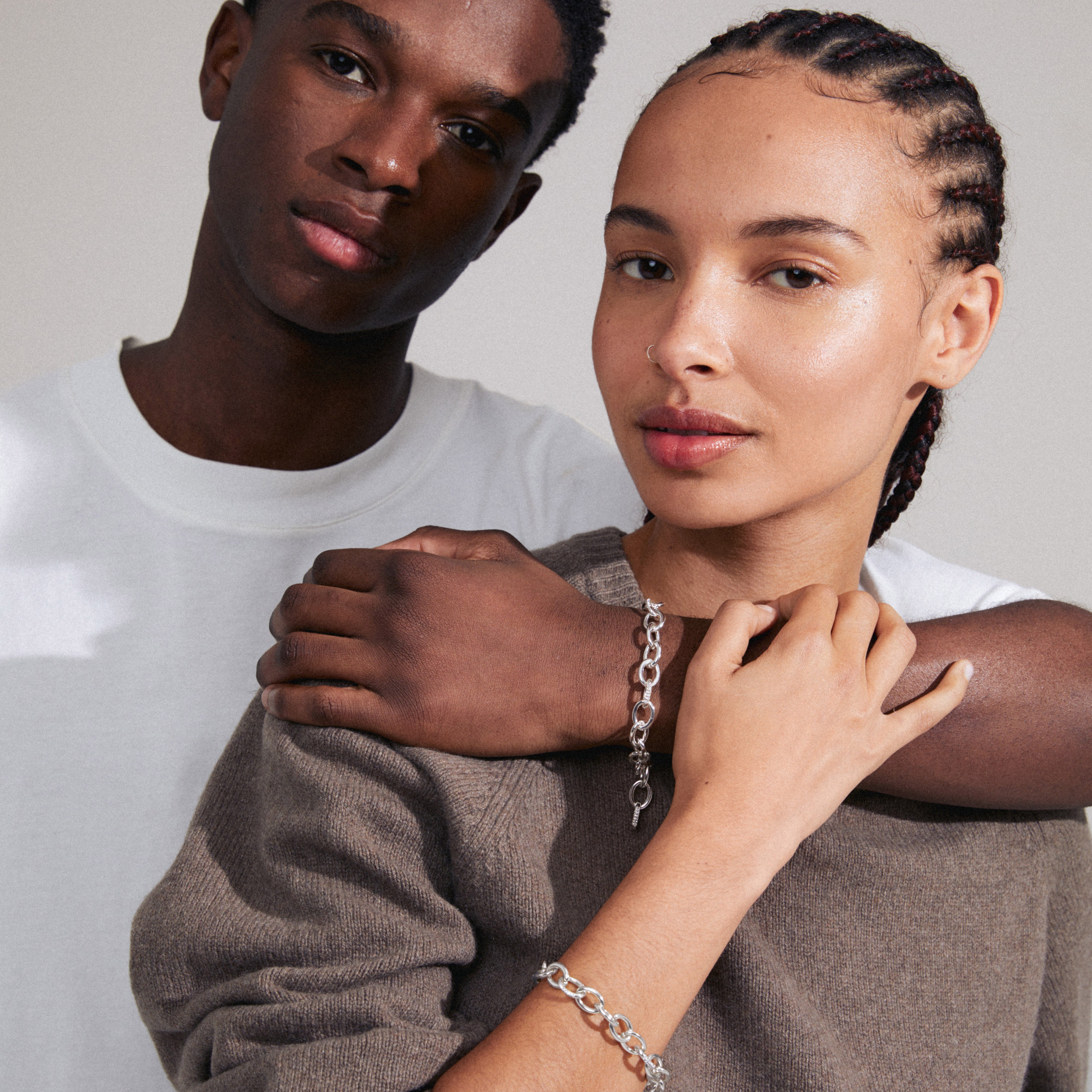 AMIRI bracelet, silver-plated, featuring a classic cable chain design with sparkling Preciosa crystals, worn on a wrist.