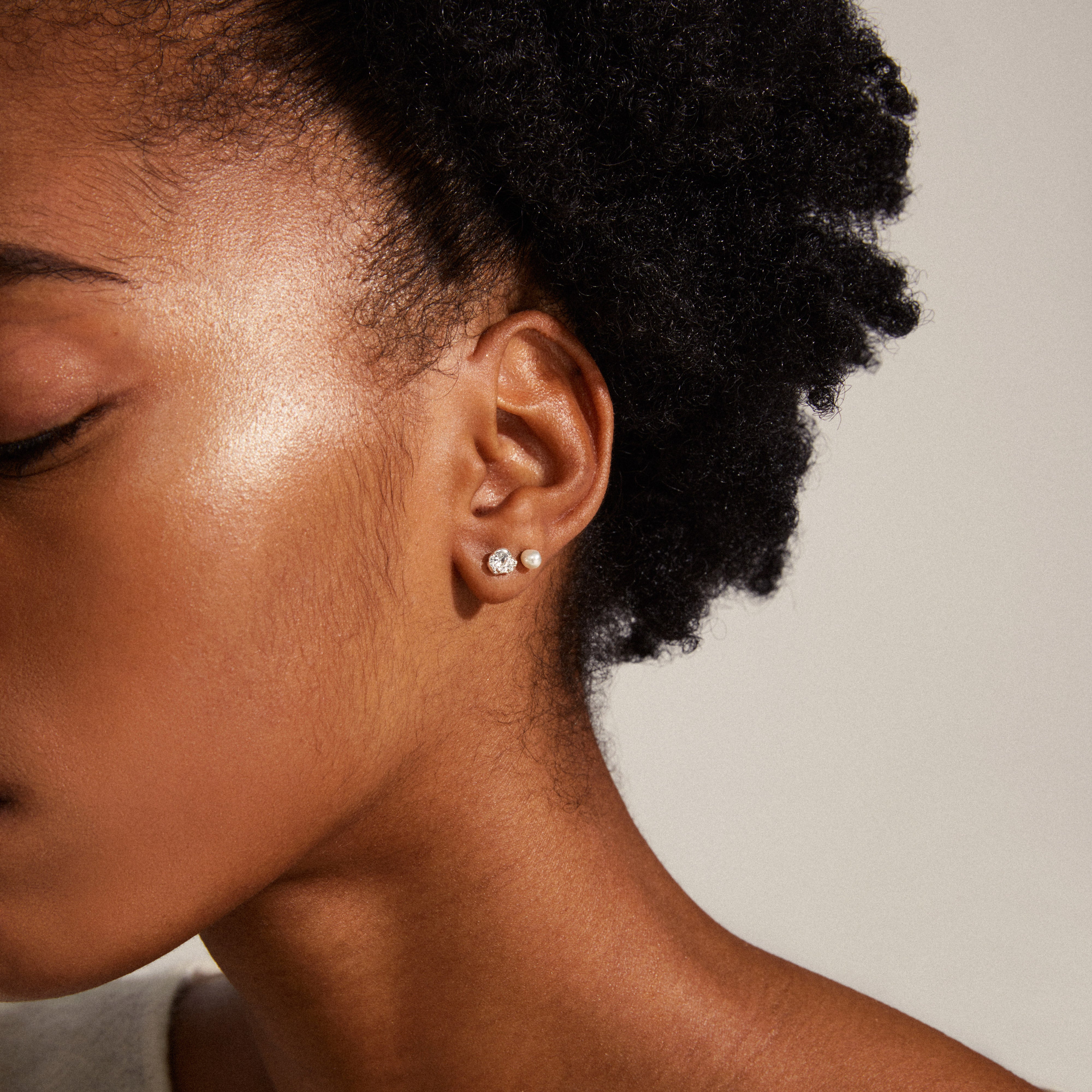 TINA crystal & pearl studs, silver-plated, showcase elegant ear curation with Preciosa crystals and pearls, emphasizing Pilgrim's recycled collection craftsmanship.