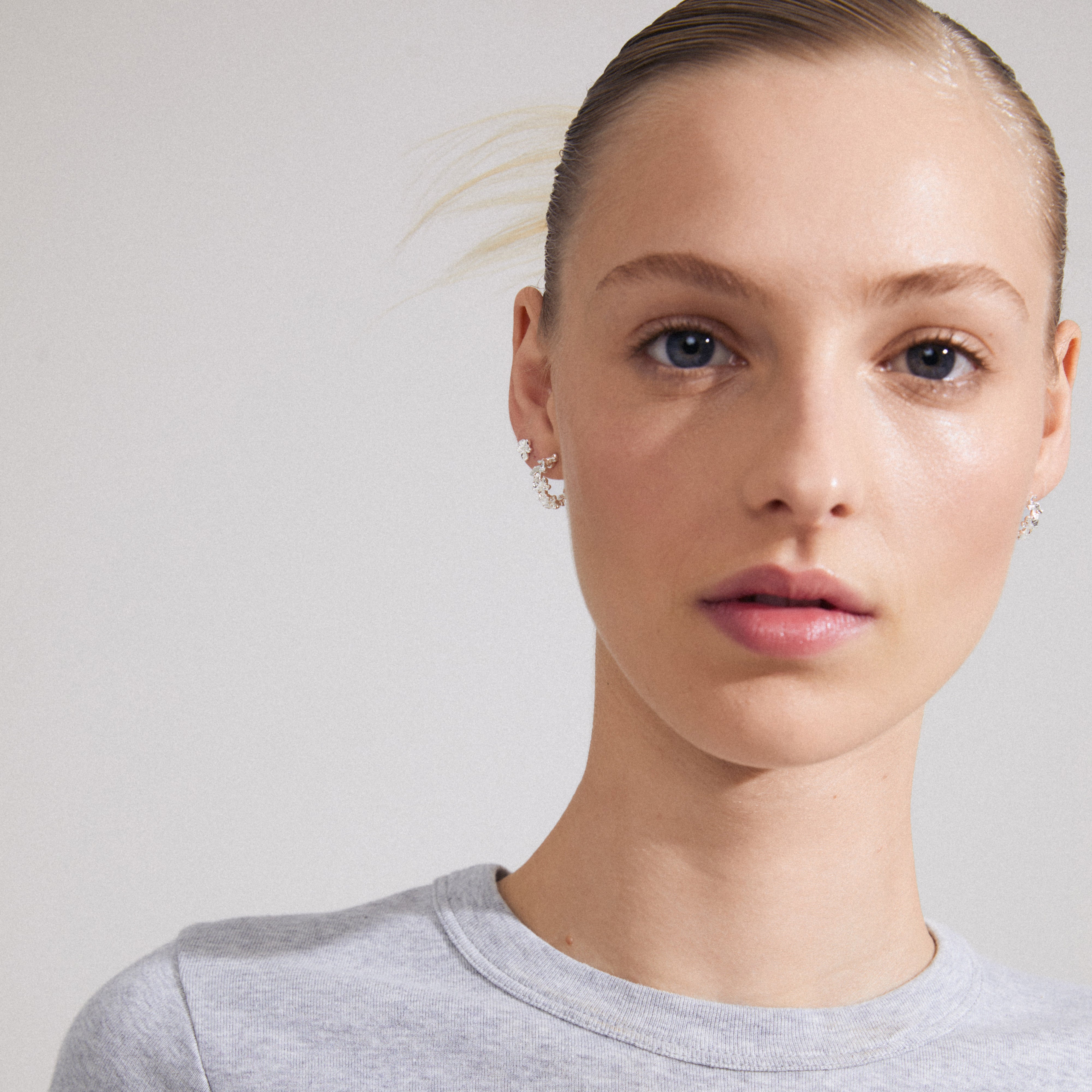 ZHURI earrings 2-in-1 set silver-plated; a close-up shows floral half hoops and tiny studs, highlighting their organic shape and detailed craftsmanship.