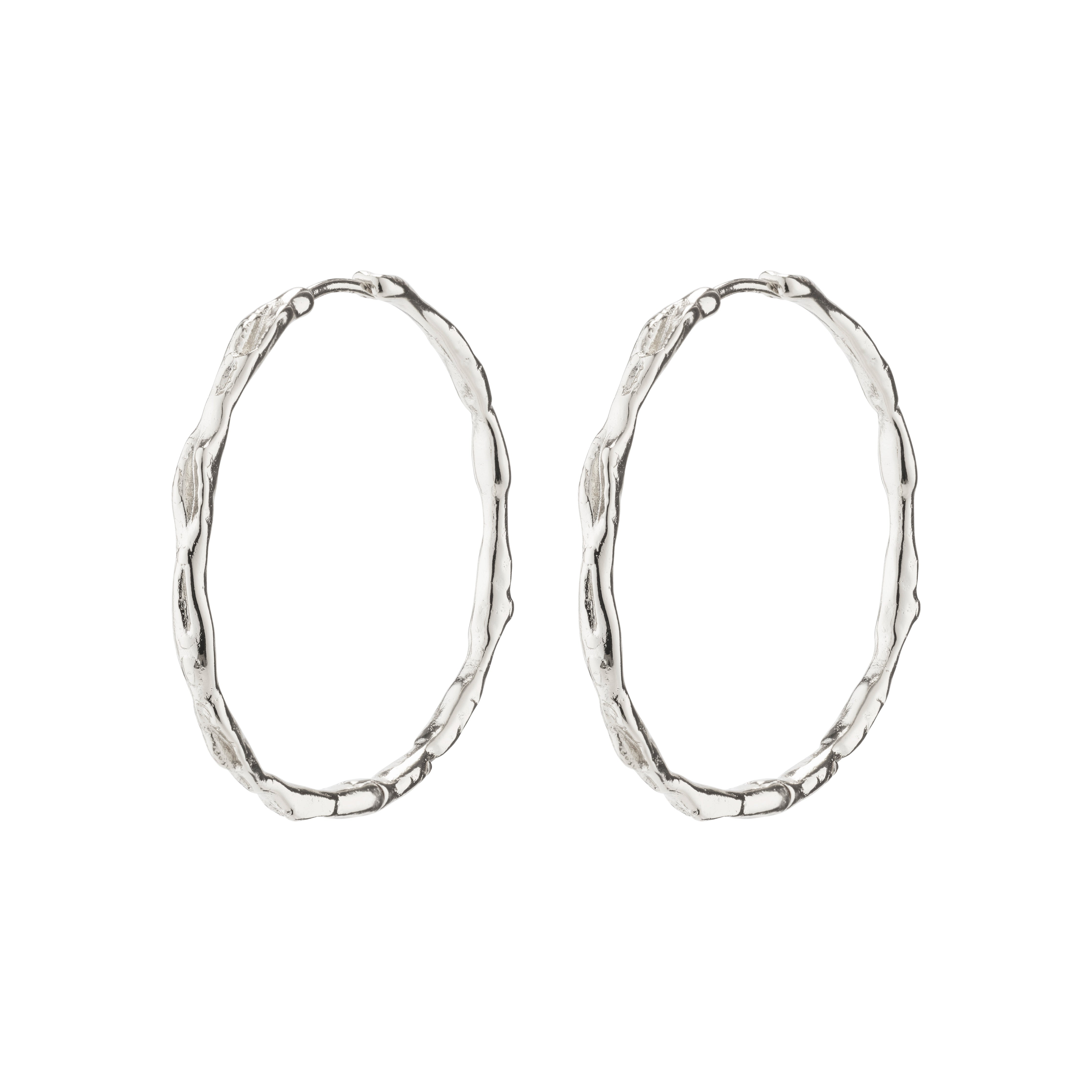 EDDY organic shaped maxi hoops, silver-plated with a wavy surface, showcasing Pilgrim's handcrafted, Scandinavian style. Perfect for enhancing any outfit or adventure.