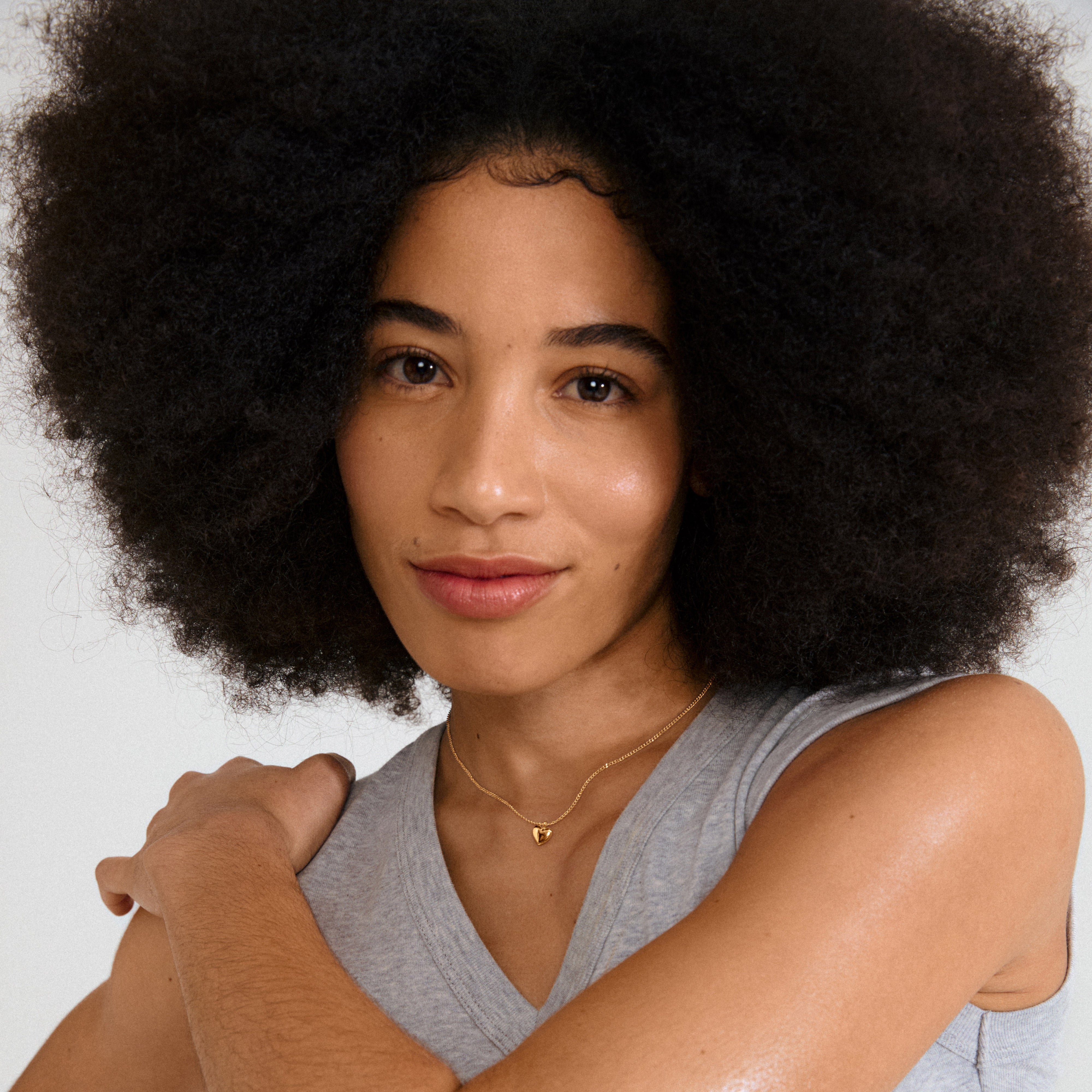 ALAIA necklace, gold-plated with a petite heart pendant, offers a romantic touch. Perfect for solo wear or layered, and crafted from 99% recycled materials.