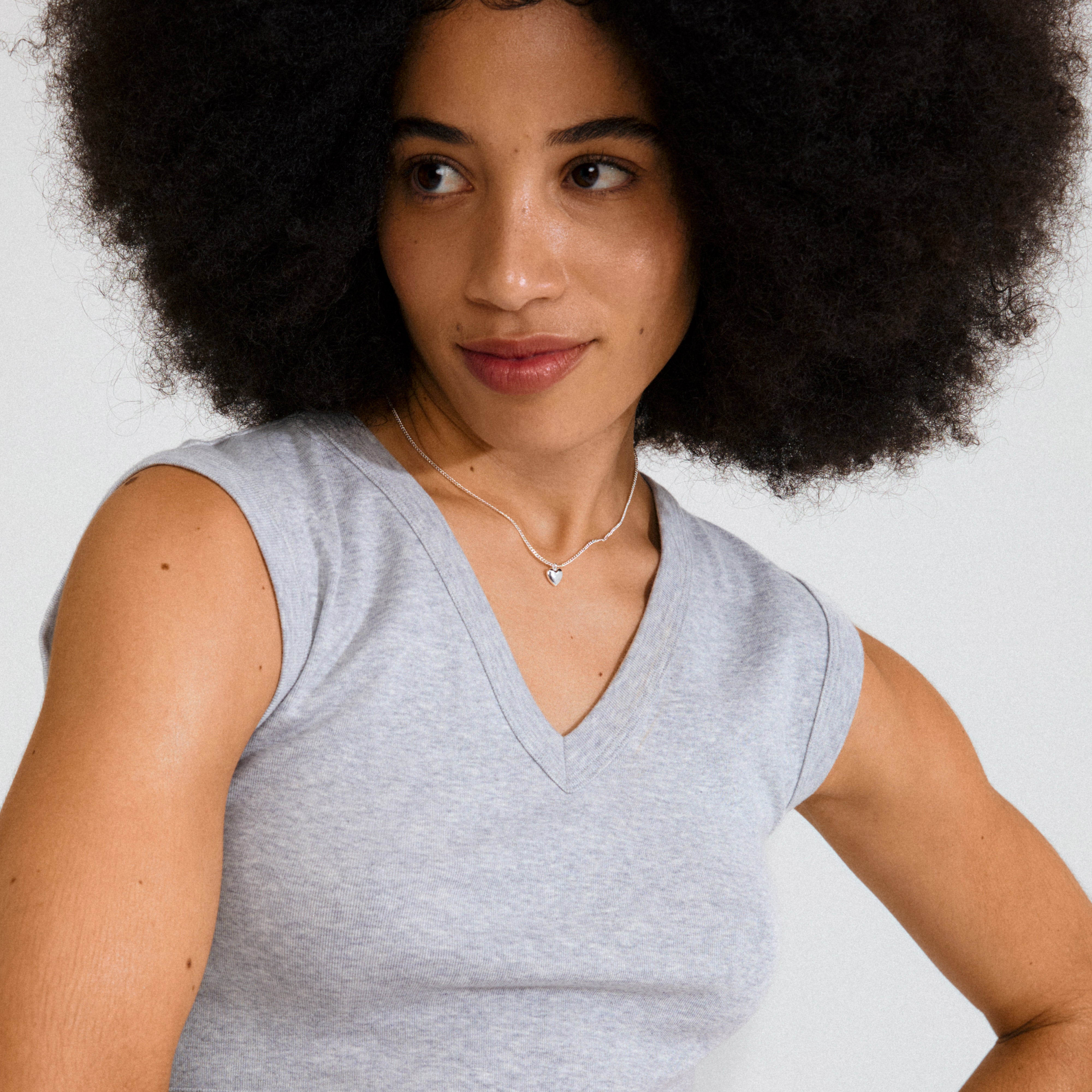 ALAIA necklace silver-plated, featuring a slim chain with a petite heart pendant, crafted from 99% recycled material for a romantic, versatile accessory.