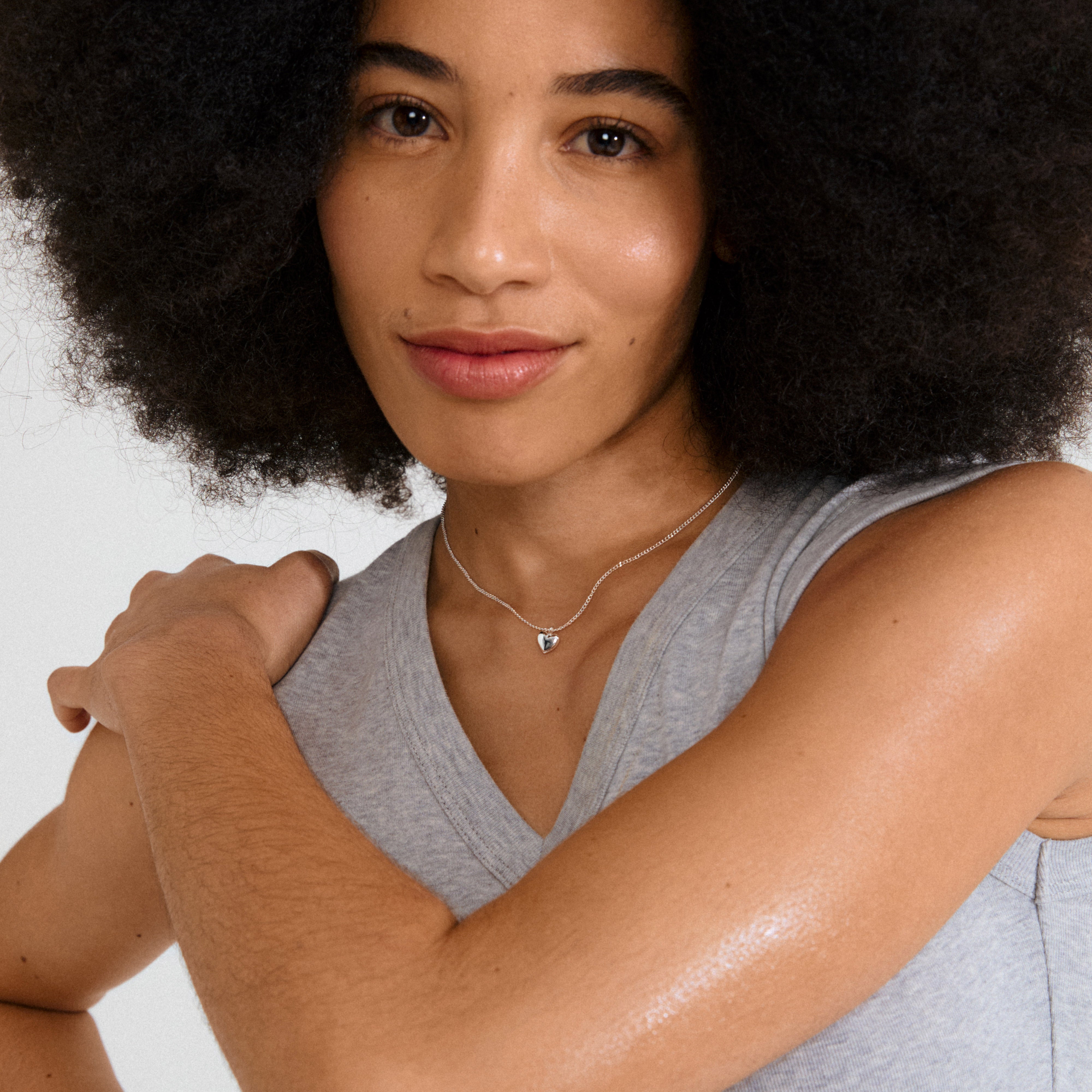 ALAIA necklace: Slim silver-plated chain with a petite heart pendant, crafted from 99% recycled materials. Perfect for layering or standalone elegance.