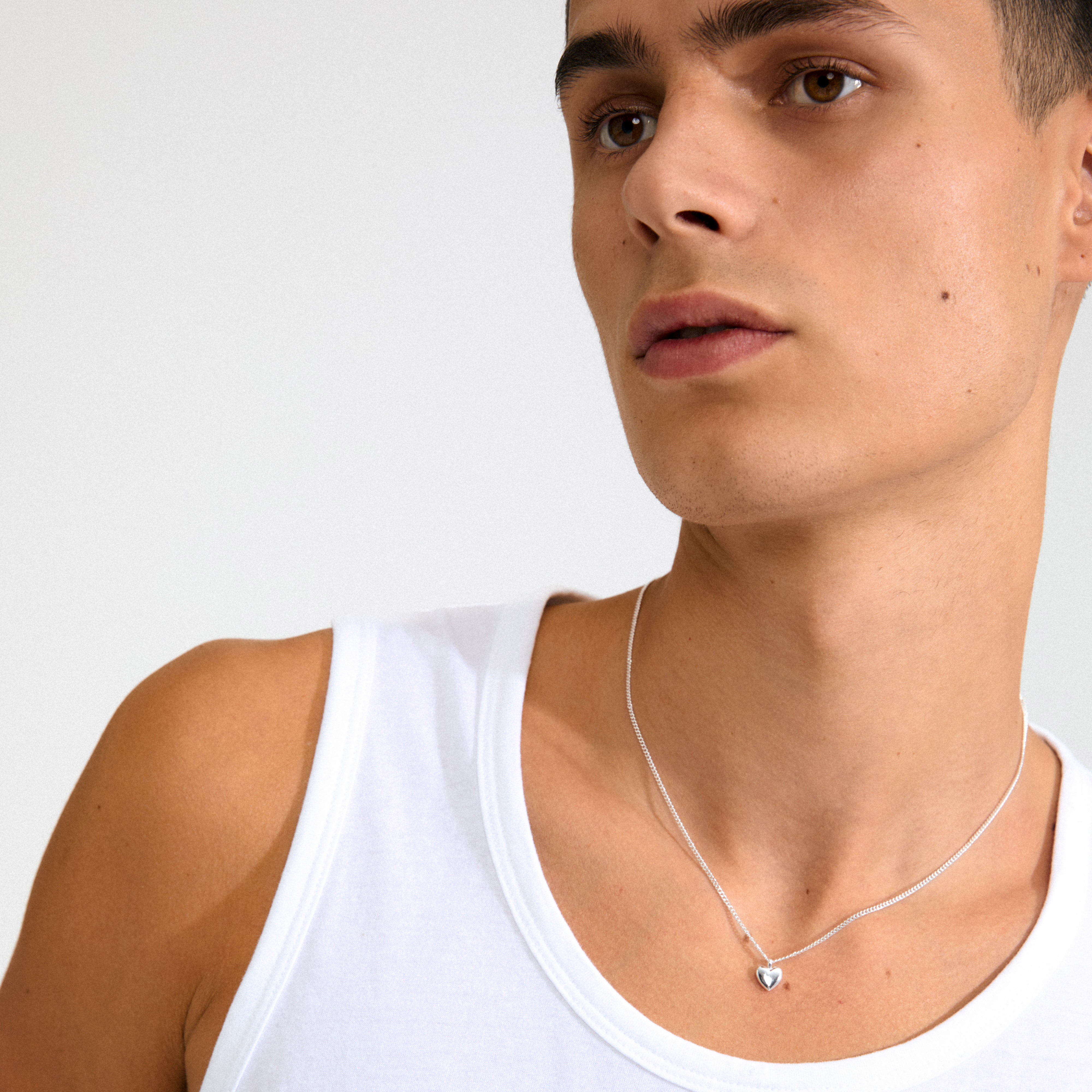 ALAIA necklace silver-plated featuring a slim design with a petite heart pendant, crafted from 99% recycled material, offering a romantic touch to any style.