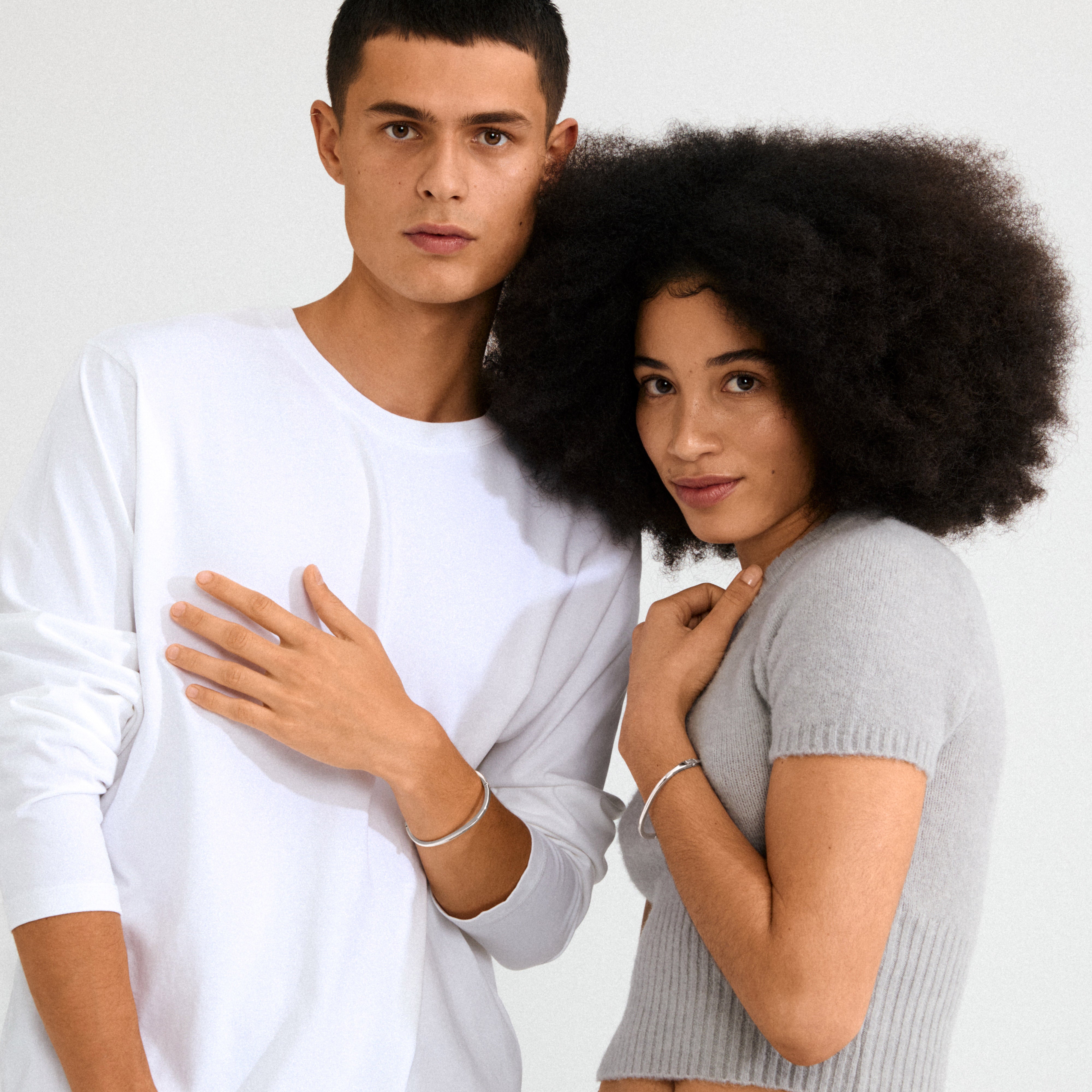 ALAIA silver-plated bangle, timelessly simple and elegant, featuring a discreet click clasp. Crafted from 99% recycled materials, perfect for solo or stacked wear.