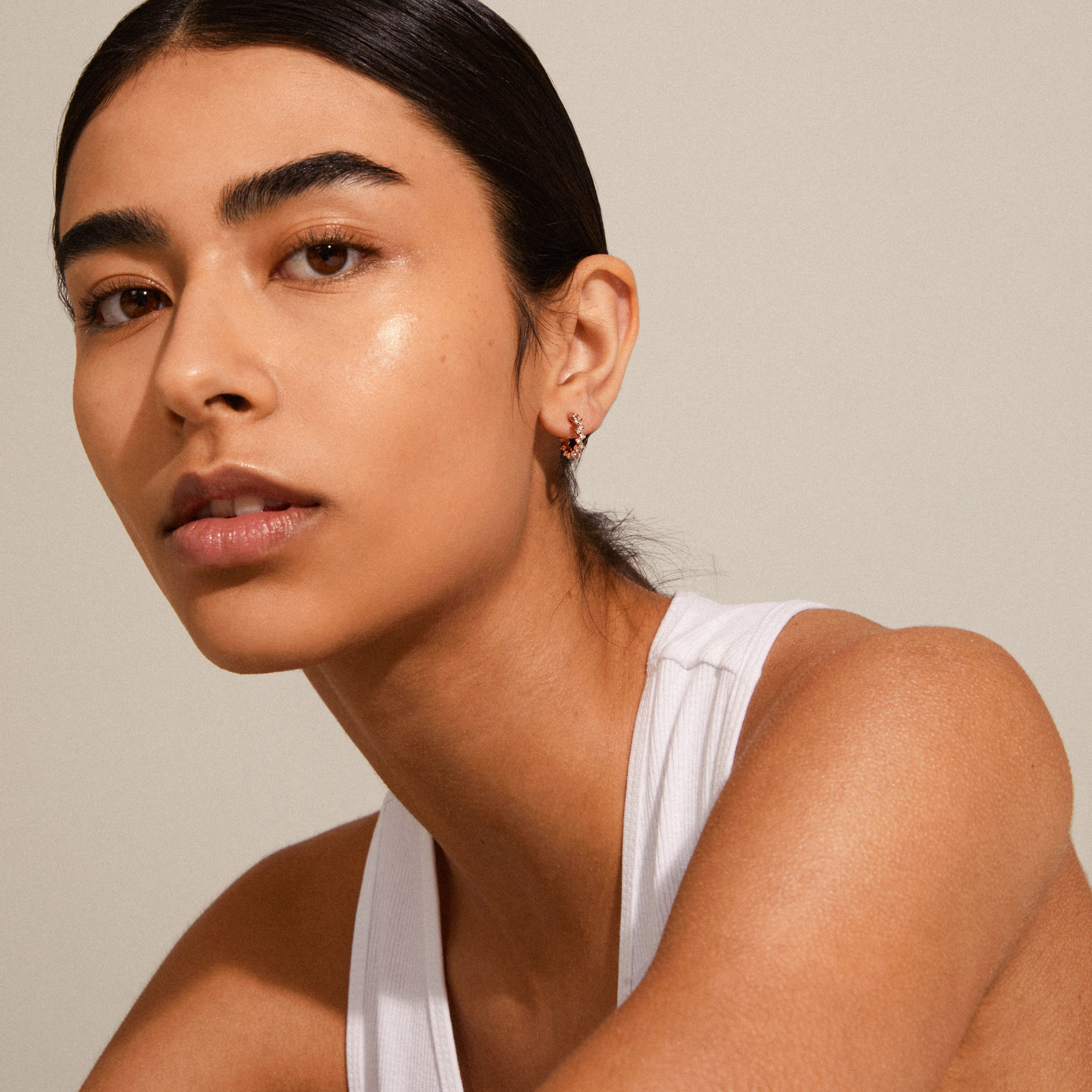 ESTER crystal hoop earrings rosegold-plated showcased on a woman, highlighting their Preciosa crystals and elegant, feminine design for a stylish, trendy look.