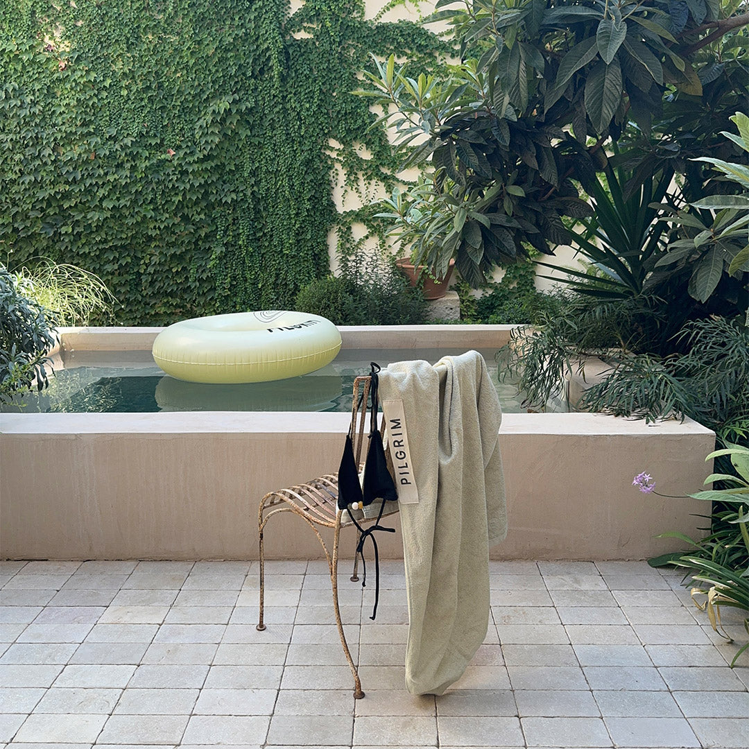 Beach Towel, 100 x 150 cm, beige, featuring Pilgrim logo, crafted from soft organic cotton, perfect for relaxing by the pool or beach.