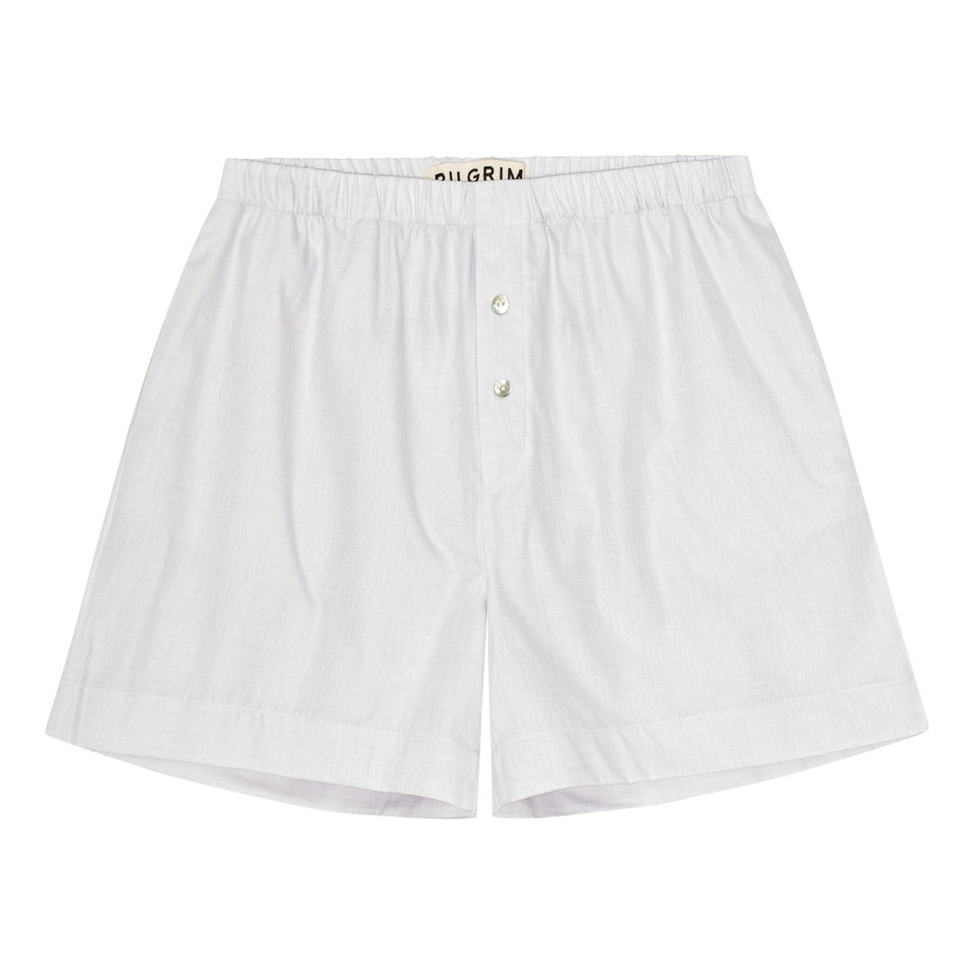 PILGRIM Shorts XS/S: Off-white, oversized cotton shorts with elastic waist, front button, side pockets, and handwritten back print for a relaxed, adventurous look.