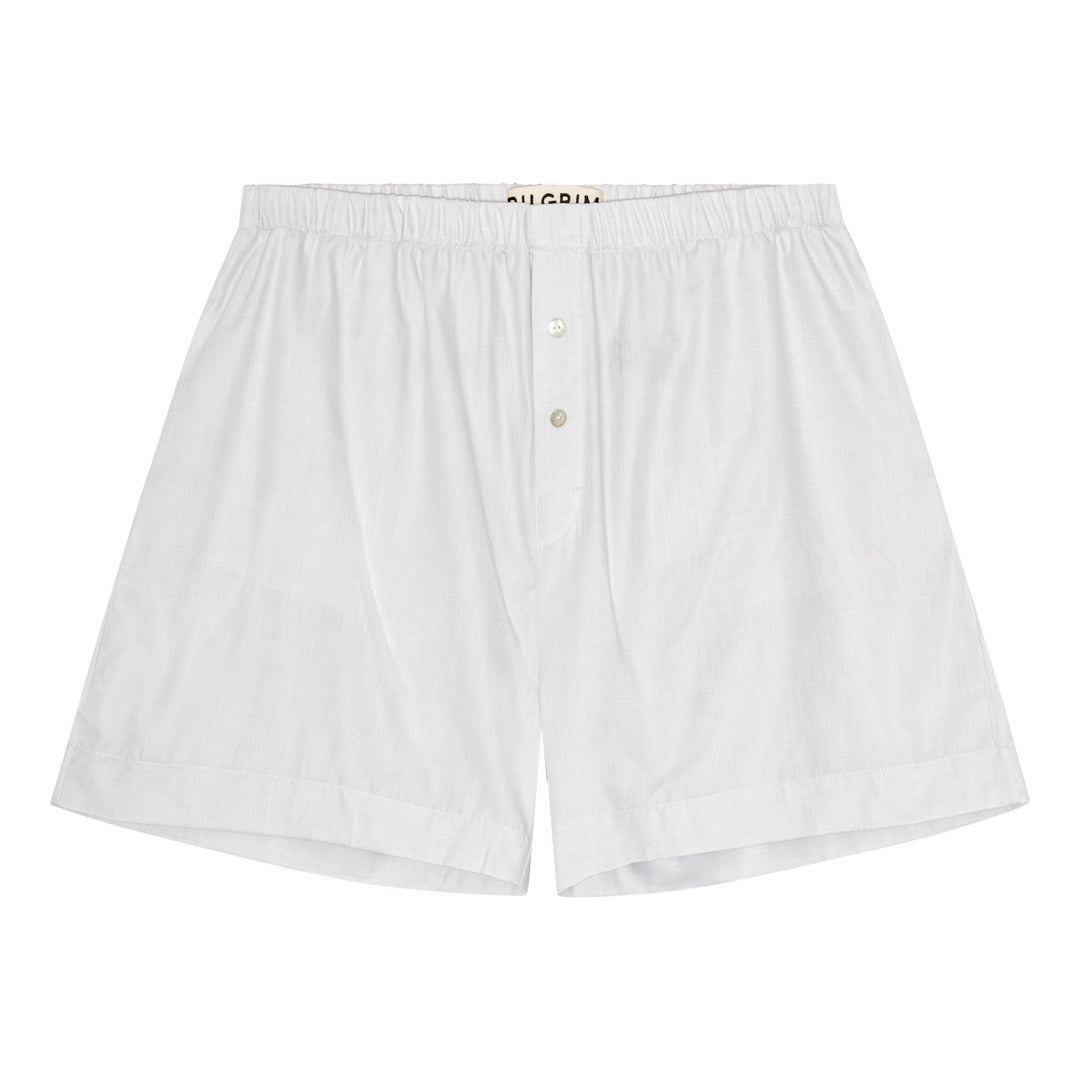 PILGRIM Shorts M/L: Off-white oversized cotton boxer shorts with elastic waist, front button detail, side pockets, and handwritten print on back for stylish comfort.