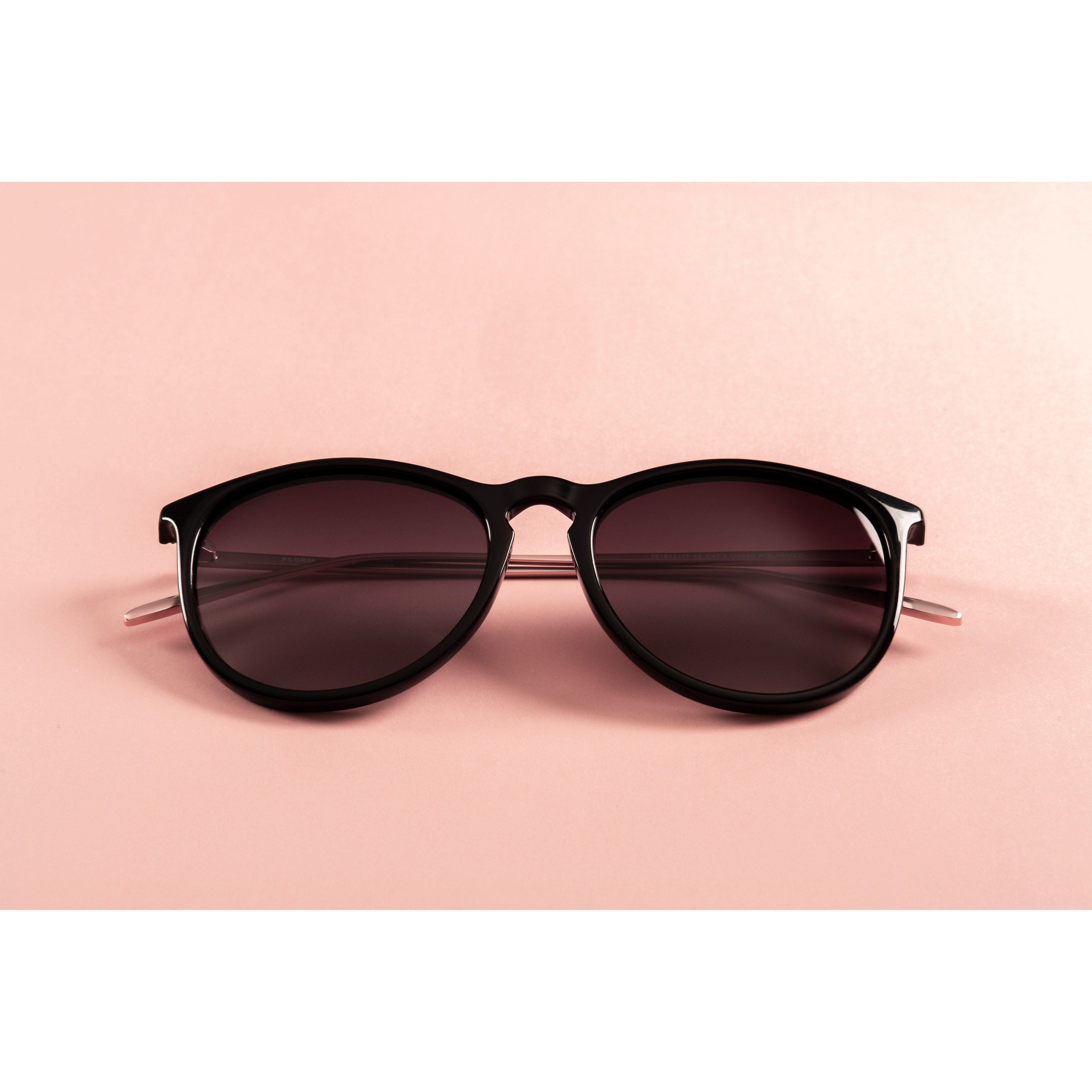 VANILLE sunglasses featuring stylish metal temples and soft rounded lenses with thin black rims, perfect for a trendy and classic look.