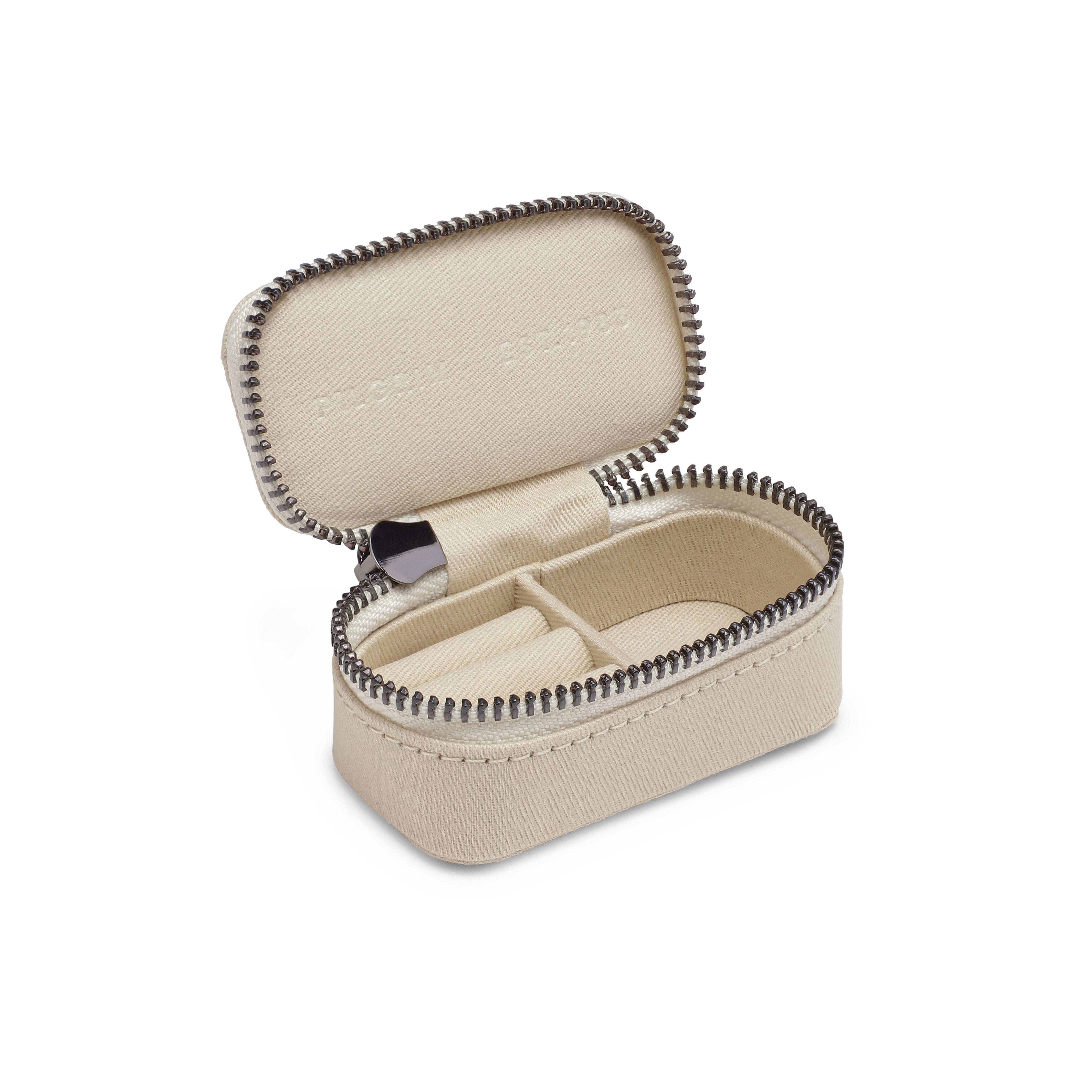 Mini jewelry box with zipper, featuring three rows for rings and earrings, plus a compartment for necklaces, in a compact, Scandinavian design by Pilgrim.
