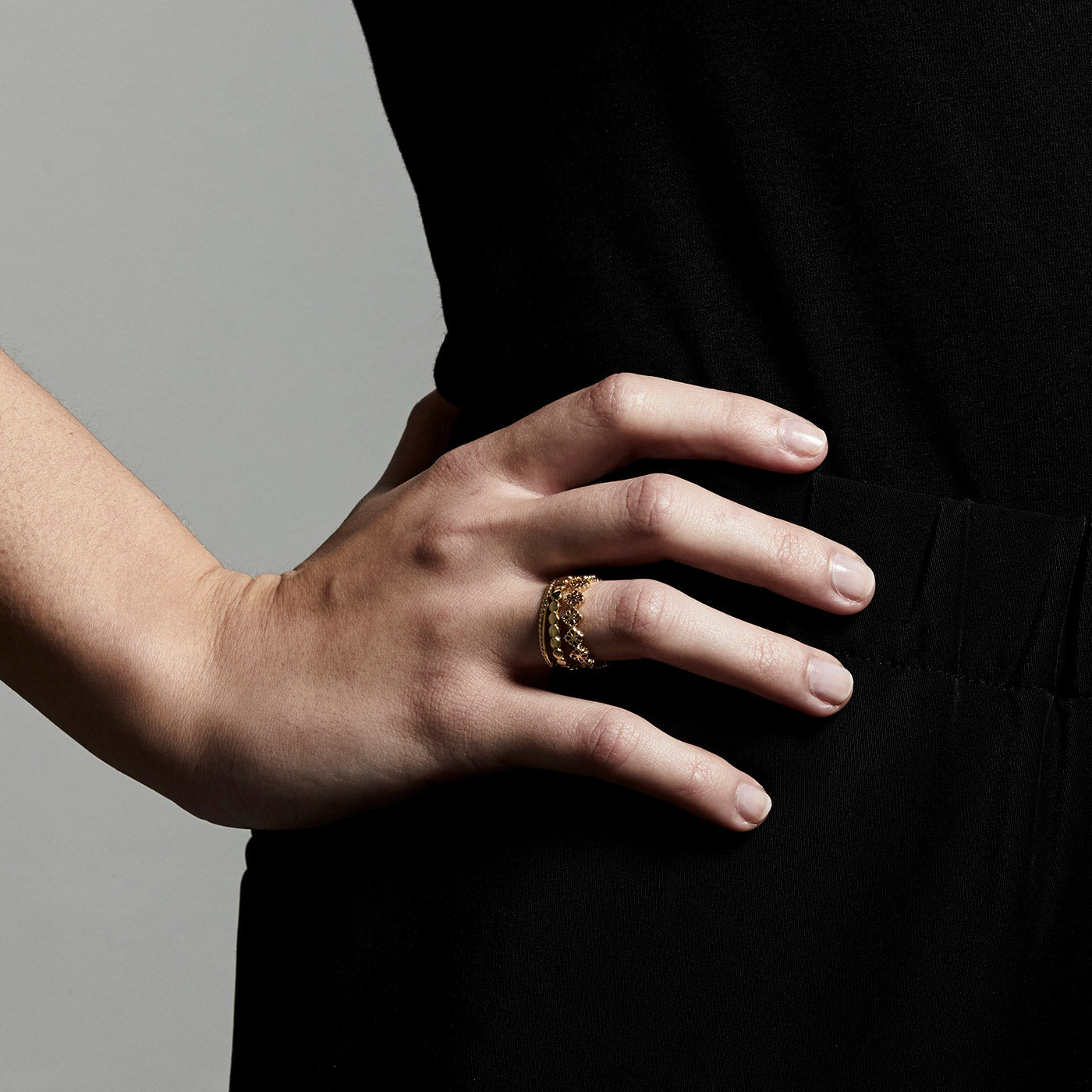 Gold-plated JOY ring on a hand, showcasing Pilgrim's delicate, adjustable design for a boho-inspired stacked look. Perfect for trendsetters seeking timeless style.