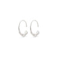 VALKYRIA silver-plated hoop earrings featuring a polished narrow ring that widens into a flat, hammered semicircle, inspired by the rugged Nordic landscape.