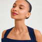 Woman with wet hair wearing Pilgrim's STARLIGHT earrings 2-in-1 set, featuring gold-plated hoops and freshwater pearl studs. Perfect for enhancing casual outfits.