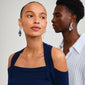 STARLIGHT earrings silver-plated, worn by a woman, feature chunky hoops with large organic pendants, showcasing Pilgrim's trendy, sustainable style.
