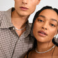 Models showcase Pilgrim's INSTANT necklace, a silver-plated choker with crumpled, textured links, radiating a handcrafted, stylish vibe.